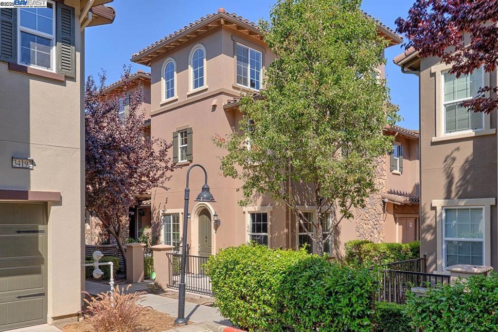 Charming and elegant tri-level townhome located in the premier Ardenwood neighborhood, featuring top-ranked schools! This desirable end-unit home offers abundant natural light and an open, spacious layout. The modern kitchen boasts contemporary cabinetry, granite countertops, a gas range, stainless steel appliances, and an island with a sink - perfect for everyday living and entertaining. The expansive primary suite includes a walk-in closet and dual sinks for added convenience. Each of the three bedrooms comes with its own en-suite bathroom, providing privacy and comfort for the whole family. Additional highlights include: Newer laminate flooring throughout. Recessed lighting and double-pane windows. In-unit laundry. Central heating and A/C. Spacious patio and 2-car side-by-side garage. Located just steps from Google and Facebook shuttle stops, this home is also close to shopping, grocery stores, and restaurants. Enjoy nearby amenities like Karl Nordvik Sports Park, Alameda Creek Trail, Coyote Hills Regional Park, the historic Ardenwood Farm, and more. Excellent commuter location with easy access to the Dumbarton Bridge, Highways 84 and 880, and the BART station. Convenient to Meta, Tesla, and other major employers. A must-see home in an unbeatable location!