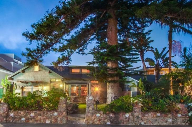 Welcome to your serene La Jolla retreat—a thoughtfully designed Craftsman style home with an additional bonus living space, perfect for families, multigenerational living, or flexible work-from-home needs.Tucked away on a quiet street just a few blocks from the iconic Windansea Beach,this home offers a rare blend of privacy, and comfort in one of San Diego’s most beloved coastal neighborhoods. Inside, natural materials and timeless craftsmanship create a warm, inviting atmosphere.Vaulted wood-beam ceilings, hand-crafted wainscoting, and wood-framed windows fill the spacious great room with light and peaceful views of the central courtyard at the heart of the home. The tranquil courtyard features a built-in BBQ, a gentle waterfall pond, and multiple spots to gather or reflect. Lush front and back yards are planted with fruit-bearing trees and vines, including guava, fig, apricot, grape, citrus and more. Custom-designed kitchen features a spacious island, bar seating, & a layout that flows easily into the home’s main living and outdoor spaces. Homes in this coveted location rarely come on the market, dont miss this opportunity. This home is more than just a place to live—it’s a space to grow, connect, and feel grounded by the rhythms of coastal life.