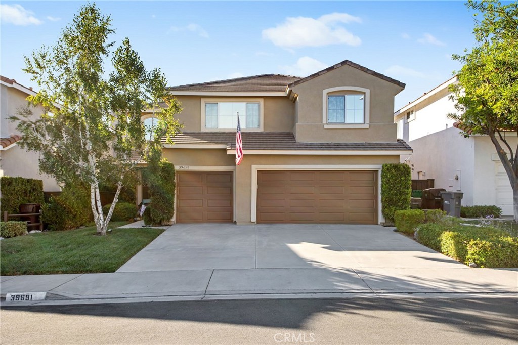 Welcome to 39691 Ashland Way, a spacious and beautifully updated two-story home offering nearly 3,000 square feet of comfortable living and breathtaking views of the natural preserve. With 5 bedrooms, 3 bathrooms, and a versatile floor plan that includes a full bedroom and bath on the main level, this residence blends functionality with a warm, inviting ambiance. Step inside to discover an open layout where the remodeled kitchen serves as the heart of the home. Thoughtfully designed with quartz countertops, stainless steel appliances, a large peninsula with bar seating, and stylish cabinetry, this space is ideal for preparing meals, entertaining guests, or simply enjoying everyday moments. Adjacent, the family room offers a cozy setting anchored by a fireplace, while large windows and sliding glass doors bring in natural light and connect seamlessly to the outdoors. Upstairs, you’ll find seriously generously sized bedrooms, a large loft, and a private primary suite with panoramic views. The ensuite bath offers dual sinks, a soaking tub, and a walk-in closet, creating a peaceful retreat at the end of the day. Whether used for guests, a home office, or multi-generational living, the downstairs full bed and bath provides flexibility and comfort. One of the standout features of this property is the tranquil backyard, where a covered patio overlooks the protected nature preserve. Imagine sipping coffee while watching wildlife pass through the open space just beyond your fence, or hosting summer BBQs under the shade while taking in golden hour sunsets. Additional highlights include updated flooring downstairs, ample storage, a 3-car garage, and a laundry room with upper cabinets for added convenience. Nestled in a quiet Murrieta neighborhood with easy access to shopping, dining, parks, and top-rated schools, this home offers both privacy and proximity. Enjoy the feeling of nature at your back door while still being minutes from everything you need. Don’t miss the opportunity to experience the lifestyle this home provides:comfort, space, scenery, and thoughtful upgrades throughout.