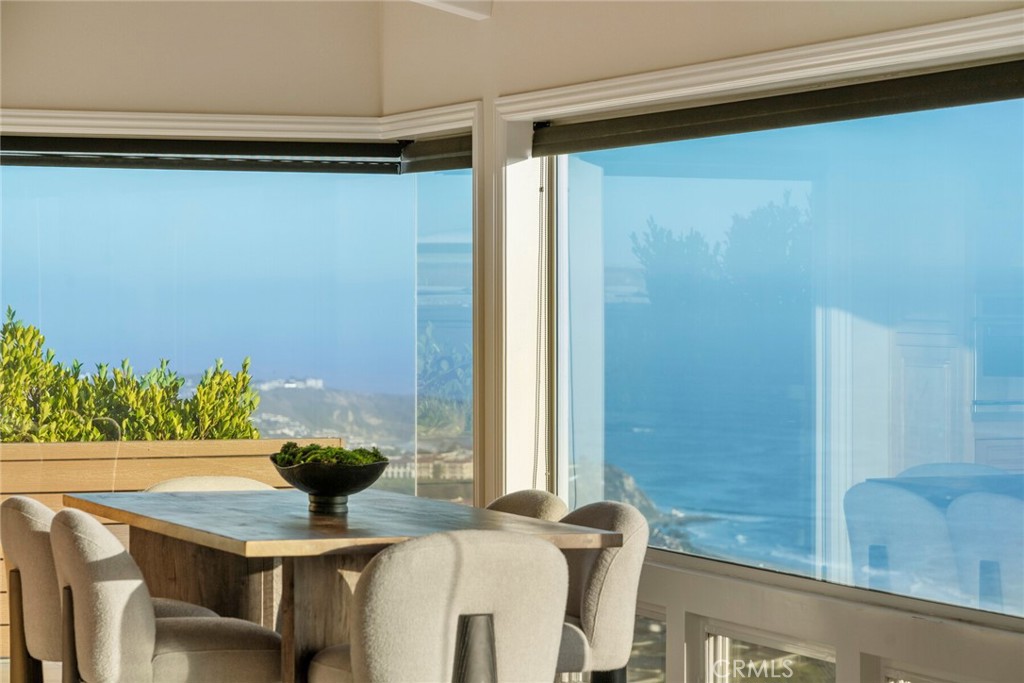 Situated high in the hills of Monarch Bay Terrace on one of the community’s premier lots, this single-level home of over 4600sqft. on a nearly 21,000sqft. lot offers breathtaking panoramic ocean views and incredible privacy. A long, dramatic, gated private driveway leads to a 3 car garage and a serene entry courtyard, setting the tone for the tranquil coastal living that awaits. Step through glass front doors to soaring ceilings, expansive living spaces, and walls of windows that frame jaw-dropping views of the Pacific Ocean. The kitchen, family room and dining room all enjoy stunning vistas that stretch from the Dana Point Headlands, with views continuing to the Ritz-Carlton, the sand and rolling white water of Salt Creek Beach and Catalina Island. The spacious primary suite occupies the northwest corner of the home, capturing some of the most dramatic views on the property. Three additional bedrooms provide ample space for family and guests, while the versatile loft is ideal as a home office, studio, or retreat. Outside, floating above the Pacific is a large deck, spa and a protected sitting area with a fireplace and also a slope with plenty of room for an orchard.Move-in ready or ready for transformation, this one-of-a-kind coastal gem offers the perfect opportunity to enjoy today or fully reimagine this unique setting to be your custom ocean-view forever home, with plenty of space for a pool, garden, expanded garage or whatever else you can dream up. Monarch Bay Terrace offers one of the best locations in Orange County: Surrounded by five-star resorts such as the Waldorf Astoria, Montage and Ritz Carlton, premier golf, world-famous beaches, walking and biking trails, the harbor and the downtowns of Dana Point and Laguna Beach, yet only about an hour to both Los Angeles and San Diego and four major airports. Don't miss out on the opportunity for this truly one-of-a-kind property.