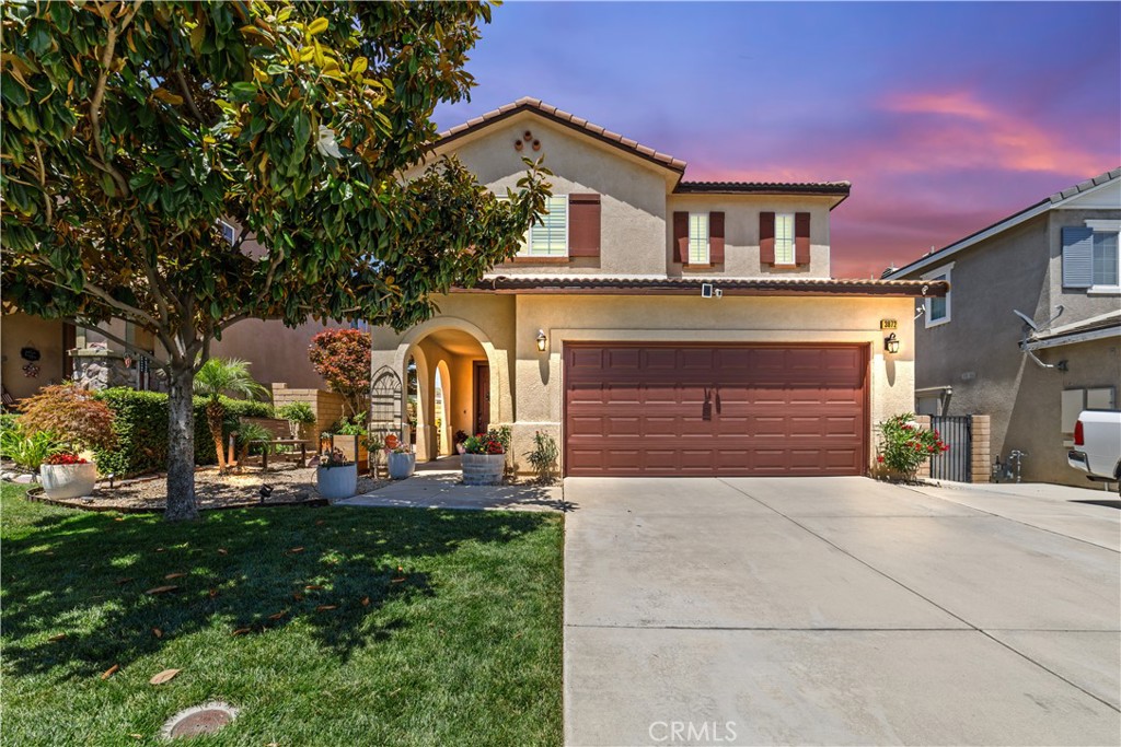Nestled in the desirable Rosena Ranch community, this beautifully appointed home blends comfort, style, and thoughtful upgrades. With 4 spacious bedrooms and 2.5 baths, it offers room to relax, entertain, and grow. LVP flooring flows throughout the main areas, while two bedrooms are carpeted for extra coziness. Ceiling fans in every bedroom and the family room add a layer of comfort, and the formal living and dining rooms set the stage for gatherings both casual and elegant. The heart of the home—an open-concept kitchen—features a large island with drop lighting, granite countertops, and a bright breakfast nook. Remote control blinds in the kitchen and family room add modern ease, while plantation shutters upstairs provide timeless charm. The primary suite is a true retreat with its own seating area, mountain views, a luxurious soaking tub, walk-in rain shower with marble tile, and a spacious Closet World-designed walk-in closet. Step outside to enjoy a large, manicured backyard with stamped concrete, fruit trees, a cozy seating area framed by mountain views, a basketball zone, and accent lighting along planter beds and pathways. The alum wood patio cover provides shade for outdoor living, and extras like a shed, dog run, water softener, 220V hook-up, and back-up generator offer practical peace of mind. A new 5-ton variable-speed Lennox AC unit keeps the home cool and efficient. With neutral tones throughout and just the right touch of personality, this home is ready to welcome you with warmth, space, and style.