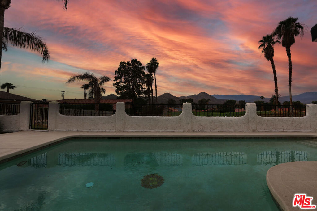 Beautifully remodeled and upkept, south facing home with private, heated pool. No neighbors in the back, it has that peaceful, tranquil, open & airy feel. New, waterproof, vinyl flooring in all rooms. 2 bedrooms on separate sides. Master/Primary bedroom has a balcony with direct access to private heated pool and gorgeous views of the mountains and golf course. Privacy in the Backyard with No neighbors. New quartz countertops in all rooms. Newer appliances. Open style, oversized living room with fireplace and open kitchen with an island. Recessed lights, beautiful ceiling fans, newer Ac & water heater. Separate laundry room and lots of closet space. Community offers 2 additional heated pools, jacuzzi/spa, tennis courts, basketball court, playground, rose garden, clubhouse/rec room available for special events with full kitchen, meeting room, free golf and more (might be a fee). 5 mins away from El Paseo, Wholefoods & Olympic size swimming pool aquatic center with waterslides. Live like you are on vacation in Paradise!!
