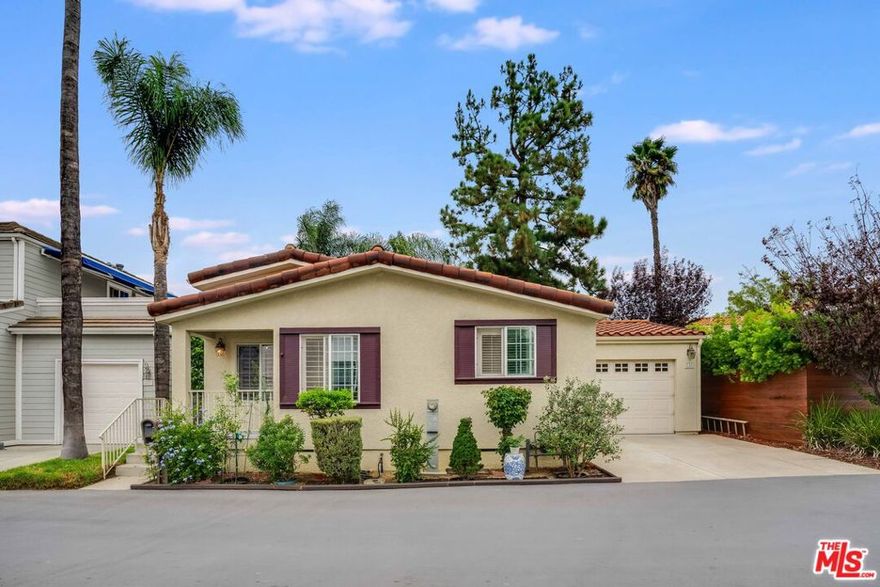 ADORABLE HOME LOCATED IN A GATED COMMUNITY JUST MINUTES TO CALABASAS AND WOODLAND HILLS AND JUST 10 MILES TO THE BEACH - 2 BEDROOMS/2 BATHROOMS AND A SEPARATE BONUS ROOM.   HIGH CEILINGS AND SKY LIGHTS AS WELL AS A KITCHEN FEATURING STAINLESS STEEL APPLIANCES CUSTOM COUNTERS AND  BACKSPLASH - THE LIVING ROOM HAS PLANTATION SHUTTERS AND A SEPARATE DINING ROOM. THIS HOME IS  IMMACULATELY MAINTAINED AND TURNKEY READY -  A SEPARATE  GARAGE WITH BUILT IN STORAGE THAT LEADS OUT BACK TO A BONUS ROOM & SHADY BACKYARD.  PARKING FOR 3 CARS THE LARGE PRIMARY BEDROOM HAS A WALK IN CLOSET AND A EN SUITE BATHROOM.  LOCATED IN A GATED COMMUNITY THE HOA MAINTAINS THE COMMUNITY POOL, SPA, GYM, & PLAYGROUND AND INCLUDES  SECURITY SERVICE - A RECENT INFRASTUCTURE UPGRADE  IN THIS COMMUNITY WITH   GAS LINES,  ELECTRIC AND WATER LINES ALL ADD TO THIS A GREAT INVESTMENT. CALL FOR A PRIVATE SHOWING - LOW DOWN PAYMENT LOANS ARE AVAILABLE AS THE PARCEL IS INCLUDED WITH A PERMANENT FOUNDATION - MAKE THIS YOUR NEXT HOME!