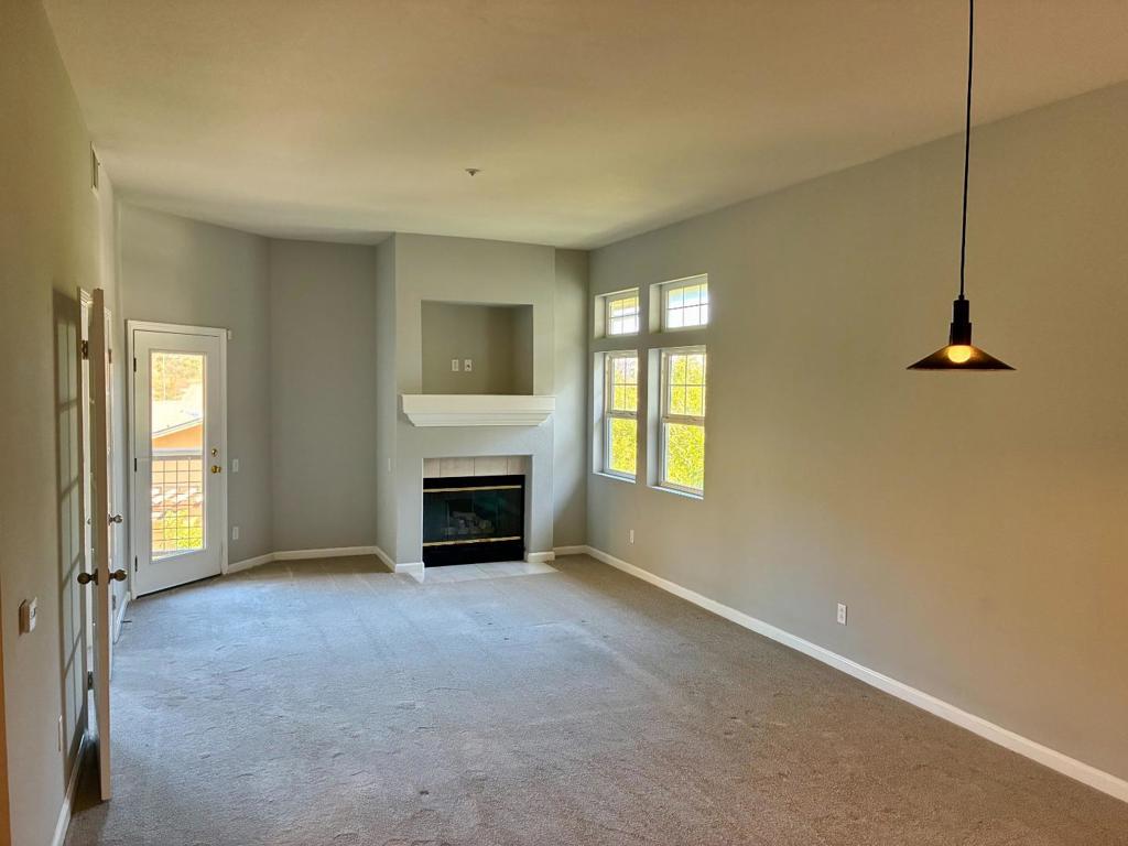 Welcome to this roomy 3-bedroom, 2-bath home featuring 1,520 square feet of well-planned living space. Located in a peaceful and serene neighborhood, this residence blends convenience with stunning views. Highlights include a spacious kitchen with modern stainless steel appliances, an open living and dining area, and plenty of windows showcasing the scenic mountain surroundings. Additional perks include an in-unit washer and dryer for extra convenience, along with two dedicated parking spaces.