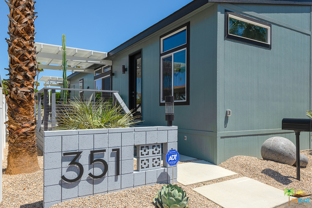 Ready to move in! One of 100 new "Tiny Houses" located at the Palm Canyon Mobile Club. This home was built in 2017 and is in "new" condition. Sellers have taken the original model to new heights with custom designer furniture, custom indoor paint job , tinted windows, custom window shades and professional landscaping and outdoor lighting. A new washer/dryer unit has been installed as well as an alarm system. A 4x8' shed has been built to match the home for extra storage. Enjoy the beautiful mountain views from your private deck. Palm Canyon Mobile Club has been reinvigorated with a remodeled clubhouse with gym, resort style pool and dog park. The monthly space rent is $650 which includes water and trash. All furniture, art and decorative accessories are included with the sale. This home is the perfect way to downsize or to have an amazing weekend retreat.