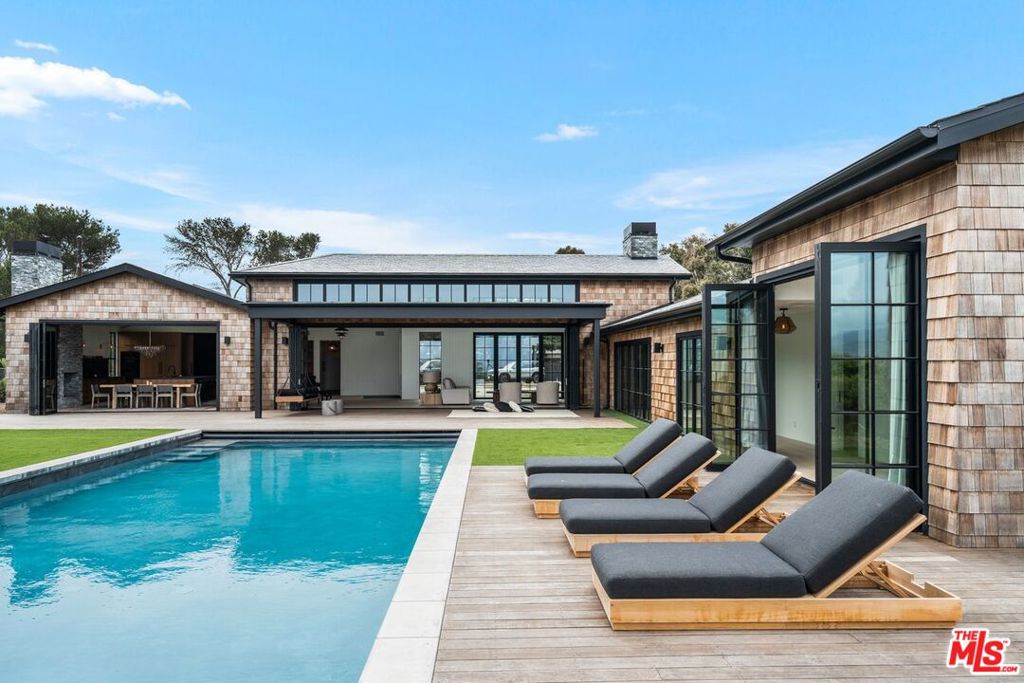 This completely remolded Point Dume Estate is a family's dream. Property features 3 bedroom with ensuite bathrooms, a state of the art screening room along with a 70 ft pool with built in jacuzzi with views straight out to the Pacific Ocean. Everything on the property is new and just waiting for tenants to come enjoy all that Malibu has to offer. Gated and secure 1 acre property is a Point Dume Oasis. A short distance to shopping and a great surf spot. Short or long term available. Property is undergoing a complete landscape makeover, landlord is offering reduced rent during landscape project. Stunning property with beautiful ocean views. House is perfect to relax in and great for entertaining with seamless indoor outdoor living.
