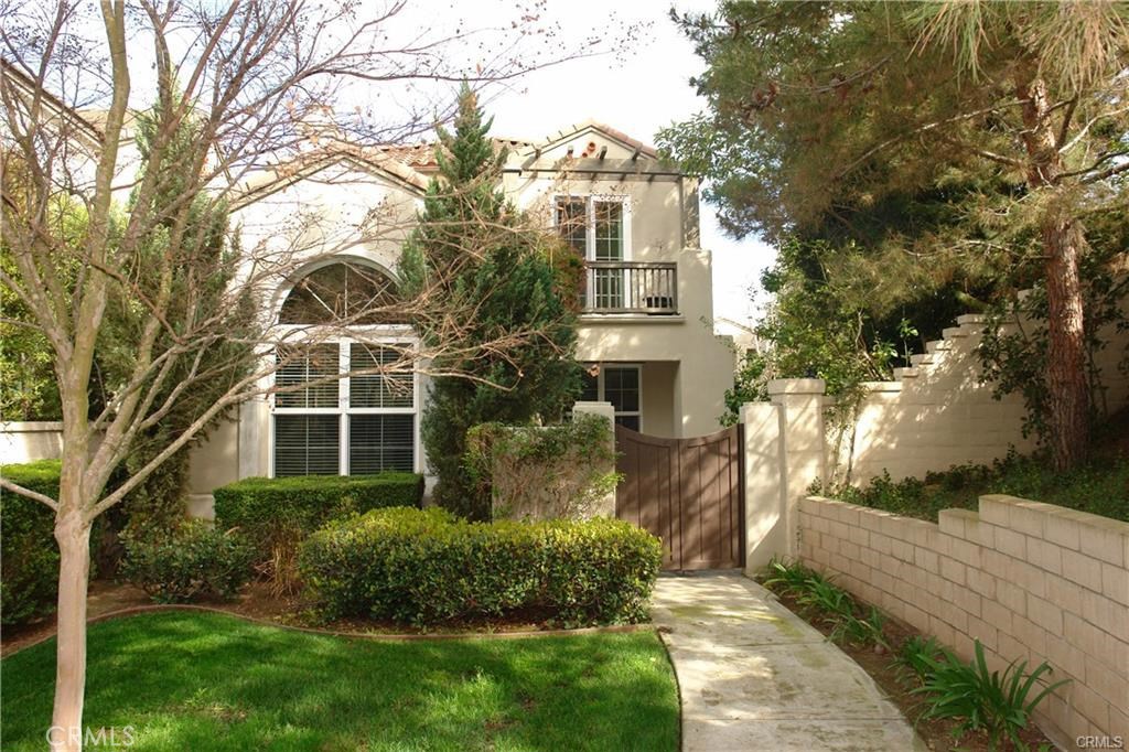 What a location for this detached home, in the prestigious community of Quail Hill. Being an end detached unit, there is a large enclosed private yard with lots of tall trees and the house faces acres of open land! No space wasted in this gorgeous 3 bedroom, 2.5 bath home. Home shows light and bright with vaulted ceilings and an open floor plan. Granite Kitchen counter tops with refrigerator included, wood flooring downstairs. Newer plush carpets upstairs. All bedrooms with closet organizers! Upstairs Laundry room. Direct access two car garage with ample storage space. Close proximity to award winning Irvine schools, attend the much desired University High ! Enjoy assoc amenities including pools, parks, gym! Easy access to freeway 405 and the Irvine Spectrum with fine dining restaurants.