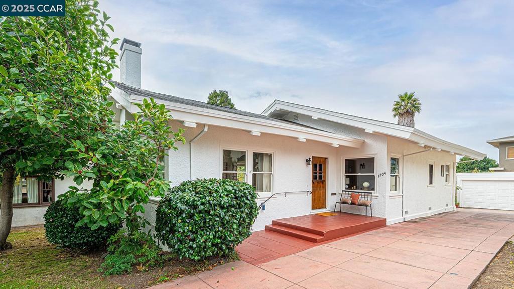 Nestled on the edge of North Berkeley, this delightful home built in 1916 captures the timeless charm of the era while offering modern comforts. Flooded with natural light, the spacious floor plan showcases gleaming original hardwood floors, recently refinished to highlight their warmth and character. The updated kitchen is a chef’s delight, featuring custom cabinetry, sleek quartz countertops, and a striking copper backsplash that adds a touch of artistry to the space. A formal dining room, anchored by a rustic fireplace and accented with the original built-ins and a bubble glass chandelier, creating the perfect atmosphere for both intimate dinners and lively gatherings. Three generously sized bedrooms provide comfort and flexibility, while the adorable laundry room, complete with sink and ample storage, adds convenience to daily living. Every corner of this sweet vintage home radiates charm, seamlessly blending vintage details with tasteful updates. Private studio or office with kitchenette and bathroom and its own entry off the back of the house, ideal for work or living with convenience and privacy. Home is perfectly situated in a highly walkable neighborhood, you’ll enjoy easy access to beloved Berkeley favorites, from cozy cafés to local shops.