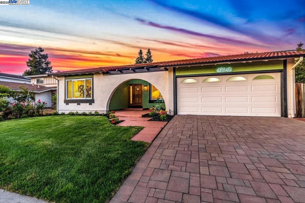 Welcome to this exceptional 4-bedroom, 2-bathroom single-family home in one of Fremont’s most coveted neighborhoods—just steps from Weibel Elementary and offering unmatched views of Mission Peak. Thoughtfully designed by a professional interior designer and meticulously remodeled from top to bottom, this home strikes the perfect balance of modern elegance, comfort, and high-end living. From the moment you arrive, the home’s architectural arch, fresh landscaping, and bold custom front door create a striking first impression. Inside, natural light floods the open living space, enhanced by designer lighting, custom finishes, and high-end tile and plank flooring throughout. The gourmet kitchen is a true showstopper—featuring premium Bosch stainless steel appliances including an induction range, microwave, and dishwasher, along with a brand-new refrigerator. Sleek quartz countertops, a charming, oversized farmhouse sink, and custom cabinetry provide both beauty and functionality. Both bathrooms have been fully remodeled with spa-inspired finishes, offering a luxurious, modern feel. The inviting family room features a striking shiplap accent wall and a modern electric fireplace, creating the perfect ambiance for cozy nights or lively gatherings.