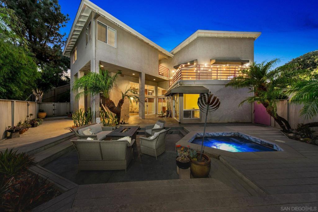 Tucked away in one of Mount Helix’s most coveted enclaves, this stunning contemporary residence offers an exceptional blend of seclusion, artistry, and modern luxury. Designed by artists, the home radiates style in every detail—from soaring ceilings and gleaming hardwood floors to walls of glass that flood the interiors with natural light. The chef’s kitchen, complete with an island and premium finishes, pairs beautifully with magazine-worthy bathrooms, walk-in showers, and a luxurious soaking tub. With four spacious bedrooms—including two primary suites with fully upgraded baths—plus a mini bar, this 3,095 sq ft showpiece is made for both intimate living and grand entertaining. Multiple outdoor gathering spaces invite you to savor panoramic mountain and canyon views, unwind in the in-ground spa, and enjoy the serenity of lush, privacy-focused landscaping. Additional highlights include a three-car garage, paid-in-full solar, and impeccable recent updates that make the home truly move-in ready. Perfectly positioned within walking distance to the iconic Mount Helix Park, this rare offering provides not only an extraordinary home but also access to the sought-after lifestyle of La Mesa—renowned for its charming village, vibrant community events, highly regarded schools, and proximity to San Diego’s beaches, dining, and cultural attractions.