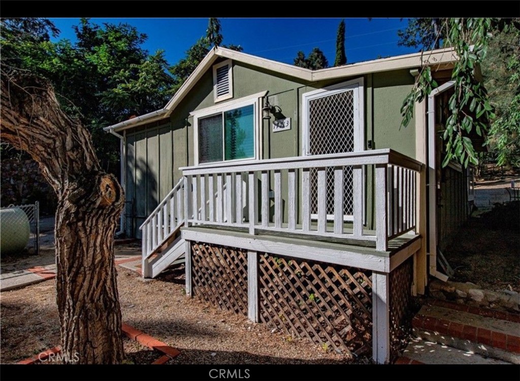 This efficient and cozy cottage, is just a short walk to visit Lake Hughes. This home is located on the edge of the Los Angeles National Forest, and offers plenty of outdoor recreation opportunities among the Mountain views. This small town life has a relaxing atmosphere for fishing, hiking, swimming and perhaps stepping out onto the famous Pacific Crest Trail (section E). This home packs a lot of features, such as OWNED solar! That's right. Other added value features consist of, a huge fenced yard, great place for a home garden, dogs, chickens and kids. Do you need a place to park toys? This extra long driveway meets a two-car garage with area for Workshop inside. Great parking for RV, boats and cars.
This 1+1, has a new beautifully upgraded bathroom, along with partially upgraded kitchen. The unique and very long entrance hall can be used for multiple purposes. Perhaps a music or reading alcove. The open concept between dining room and living room steps into the kitchen and through to an oversized laundry / mudroom with two entrance doors. One to the backyard and one for easy parking to bring in groceries. Per assessor this home is 510 sf, however, approx. 330 sf is Non-permitted. This is a wonderful home with lots of prospect. City life is not that far from your perfect nature getaway.