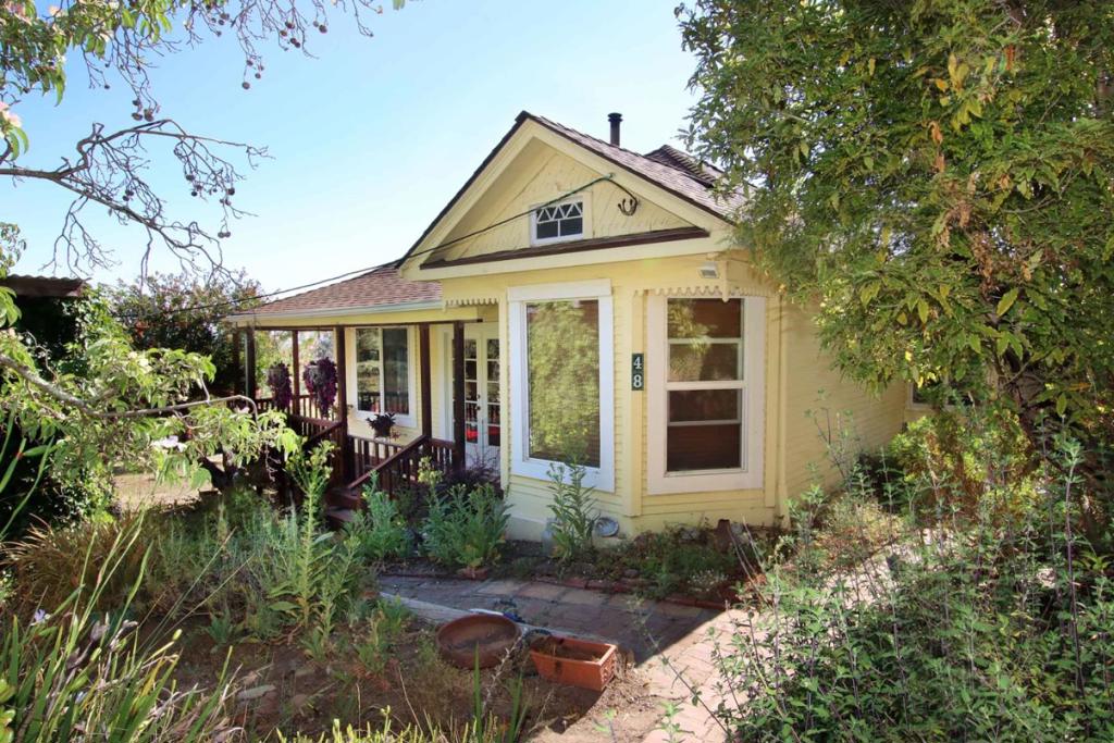From much of this magical 7.7acre property you can see both the sunrise, & the sun setting over the ocean. This is a rare combination of rolling fields and gorgeous views over the Pajaro valley out to Ventana Wilderness. Perfect for a multi-family compound. 2 Separate & private homes plus Barn/studio. The 1912 ranch house with 3 bedrooms, original fir floors, old fashioned parlor, claw-foot tub/shower, farmhouse kitchen with ocean view & wrap around porch ideal for relaxing & watching wildlife & long vistas. The second 1966 home is 2b/2ba & has its own private garden, patio, sitting deck & 2 car garage. A recently renovated barn is set up as its own special unit w/ a sleeping loft that looks out over the land, offers additional living area. There is an artist studio & workshop area. All this land is accented w/ multiple mature fruit trees & garden areas - Orange, persimmon, avocado, plum, apple. Many lovely sitting areas w/ views over the rolling fields and glorious property with areas to hike & explore. Good well withnew pump. 2 Septic systems with clearance.