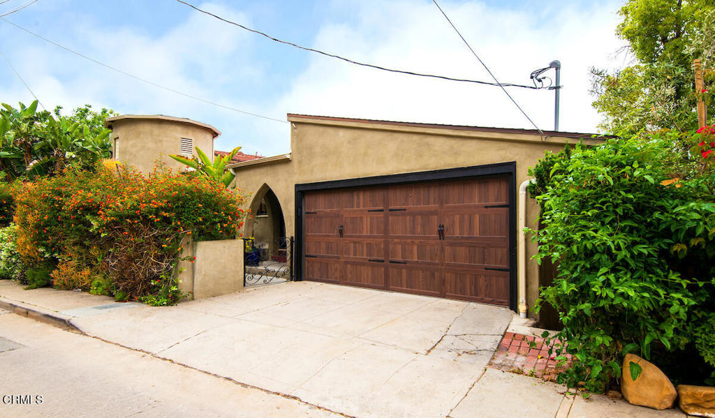 Welcome to this beautiful two story, gated 1936 Spanish home nestled in Franklin Hills with panoramic views, outdoor entertaining areas and fruit trees. As you enter the home you immediately notice the original attributes accustomed to a Spanish home of this era, from the beautiful hand-painted tiles on the staircase & floor, original cast iron handrails, arched doorways and two quaint alcoves perfect for sitting. This two story home consists of 5 bedrooms, ample storage, refinished hardwood floors, tons of natural light and 3 bathrooms beautifully restored to reflect the style and era of the home. The home boasts numerous upgrades throughout to include a newly remodeled kitchen with all new KitchenAid appliances, tankless water heater, whole house water purification system, wine cooler and an HVAC unit for each floor The first floor consists of 1 bedroom with an attached 3/4 bath, dining room, kitchen and the spacious beamed ceiling living room with a picturesque views and a large Spanish tiled fireplace. Downstairs is where you will find 3 additional bedrooms, 2nd bathrooms, laundry room and the huge master bedroom highlighted with a large master bath that hosts a claw bath tub, walk-in shower, dual sinks and enclosed toilet area. A few highlights not be be forgotten are original hardwood floors throughout, dual pane windows, freshly painted rooms and original hardware, tile work and lighting fixtures. The home has been lovingly maintained and upgraded & is walking distance to shops restaurants and all that the neighborhood has to offer.