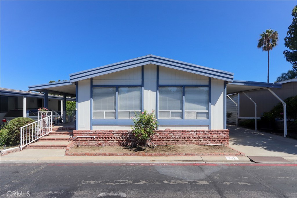 Welcome to Anaheim Shores Estates, 1919 W Coronet Way #221. A beautiful and affordable home to live in Orange County, CA!
This spacious triple-wide 2-bedroom, 2-bath home offers comfort, style, and modern upgrades throughout.
Step into the updated kitchen featuring soft-close pull-out drawers, quartz countertops, a full designer backsplash, stainless steel appliances (including dishwasher), recessed lighting, and a custom pantry. The open layout seamlessly flows into the large family room, which features laminated flooring, a cozy gas fireplace, and a built-in wet bar with a sink and cabinets, perfect for entertaining. The dining area with built-in cabinetry opens seamlessly to the light-filled living room.
The extra-large primary suite includes a wall-to-wall walk-in closet and an upgraded bathroom with a walk-in shower. A separate laundry room provides ample storage, shelving, and a built-in sink. Additional highlights include a newer roof, some replaced windows, central A/C, forced heating, updated kitchen and bathrooms, and includes automated sprinklers. The extra-long carport, accompanied by a storage shed, offers a nice convenience.
Located in the desirable Anaheim Shores Estates community, residents enjoy access to a clubhouse, BBQ area, pool, spa, greenbelt areas, and abundant guest parking. The monthly pace rent is only $ 1,725, one of the lower rates in the area.