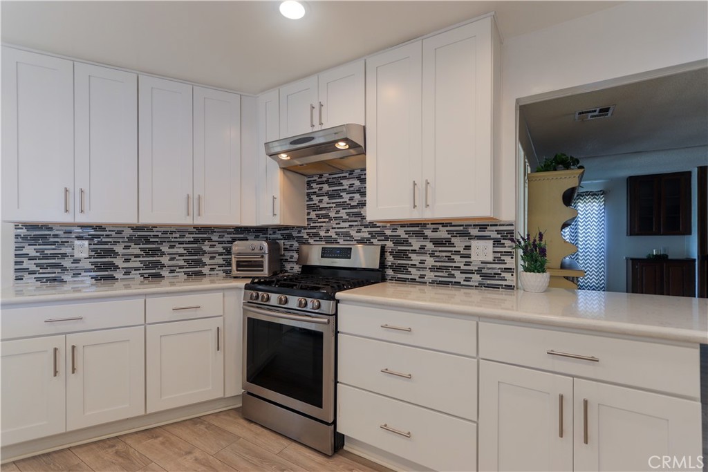 Welcome to Anaheim Shores Estates, 1919 W Coronet Way #221. A beautiful and affordable home to live in Orange County, CA!
This spacious triple-wide 2-bedroom, 2-bath home offers comfort, style, and modern upgrades throughout.
Step into the updated kitchen featuring soft-close pull-out drawers, quartz countertops, a full designer backsplash, stainless steel appliances (including dishwasher), recessed lighting, and a custom pantry. The open layout seamlessly flows into the large family room, which features laminated flooring, a cozy gas fireplace, and a built-in wet bar with a sink and cabinets, perfect for entertaining. The dining area with built-in cabinetry opens seamlessly to the light-filled living room.
The extra-large primary suite includes a wall-to-wall walk-in closet and an upgraded bathroom with a walk-in shower. A separate laundry room provides ample storage, shelving, and a built-in sink. Additional highlights include a newer roof, some replaced windows, central A/C, forced heating, updated kitchen and bathrooms, and includes automated sprinklers. The extra-long carport, accompanied by a storage shed, offers a nice convenience.
Located in the desirable Anaheim Shores Estates community, residents enjoy access to a clubhouse, BBQ area, pool, spa, greenbelt areas, and abundant guest parking. The monthly pace rent is only $ 1,725, one of the lower rates in the area.