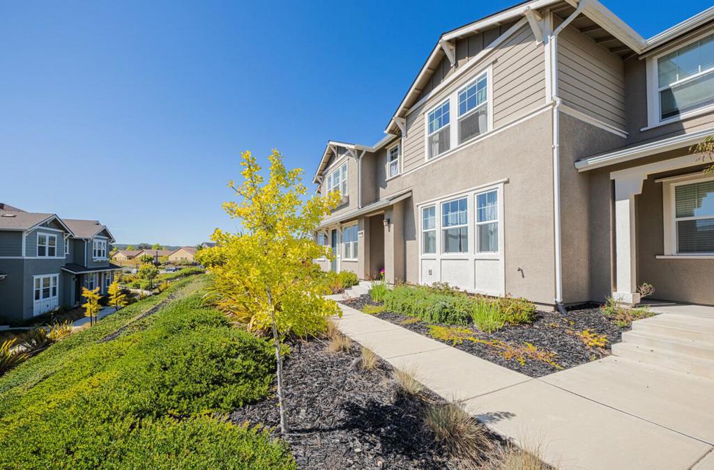 Welcome to this exceptional, turnkey townhouse in the highly desirable East Garrison Community! This beautifully appointed and spacious home features brand new wide plank flooring throughout the downstairs with an open great room floor plan, and three generously sized bedrooms upstairs. The kitchen features granite counter tops and stainless steel appliances and flows seamlessly to the large living room and dining area. There is beautiful wide plank flooring upstairs with built-in cabinetry in the hall area, a separate laundry room, a huge primary suite with a large walk-in closet, ceiling fans, and double sinks in both of the upstairs bathrooms. There are tile floors in all of the bathrooms and the laundry room, a convenient and beautiful 1/2 bath downstairs, a pantry off of the kitchen, and an attached 2 car garage. The landscaping is meticulously maintained and there are several beautiful community parks and playgrounds withing walking distance. The East Garrison Community is centrally located and within reach to so many of the local coastal recreational activities, making this a wonderful place to call home!