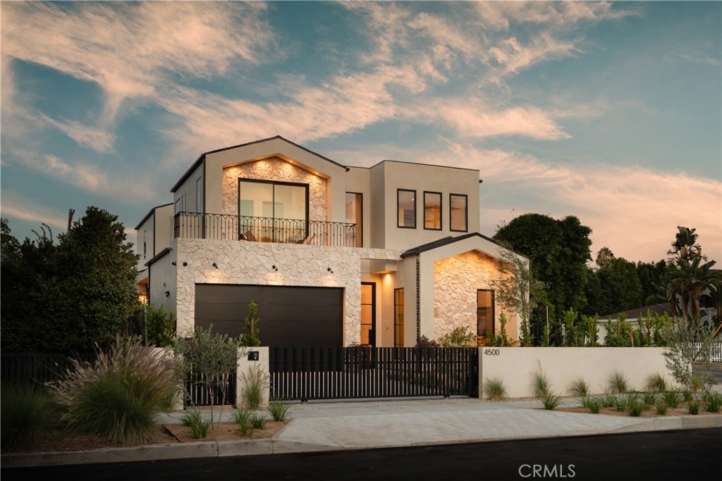 Welcome to 4500 Calhoun Ave, an extraordinary new construction in the heart of Sherman Oaks, built and designed by Thynk Developments. This 2025 architectural masterpiece seamlessly blends organic textures with minimalist design to create a warm yet sophisticated living environment. Clad in travertine stone, the striking exterior sets the tone for the refined elegance found throughout the home. Nearly every wall and ceiling is finished in hand-applied limewash, complementing the home’s soaring 11-foot ceilings and creating a warm, natural aesthetic. Expansive doors and an open-concept floor plan flood the interior with natural light.
The sleek chef’s kitchen is a centerpiece, featuring top-of-the-line Thermador appliances, oversized center island with breakfast seating, Dekton countertops, butler’s pantry, and a built-in espresso bar.
The lavish primary suite offers a private balcony, fireplace, spacious walk-in closet, and spa-inspired bathroom. All additional bedrooms are ensuite and generously sized for comfort and privacy.
The backyard is a true retreat, complete with a sparkling pool/spa, cabana, built-in BBQ bar, and outdoor shower/bath—perfect for both entertaining and relaxation.
Additional amenities include: Control 4 Smart Home System, Built in Security Features of Alarm and Cameras, Expansive Sound System in Place, A maximized solar system covering the roof for energy efficiency. Prime tree-lined street location, just minutes from Ventura Blvd’s shops, dining, and entertainment
This Sherman Oaks gem delivers unmatched quality, thoughtful design, and true California living.