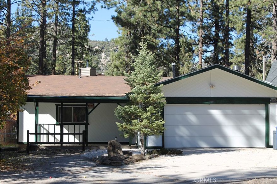 Charming single-level home in the desirable Peter Pan Area of Big Bear City. This cozy 2-bedroom, 1-bathroom home boasts an attached 2-car garage and sits on a spacious double fenced lot. Recently updated with fresh paint and new carpet, this home is move-in ready with no additional work required. Enjoy the peaceful surroundings and convenient location of this lovely property.