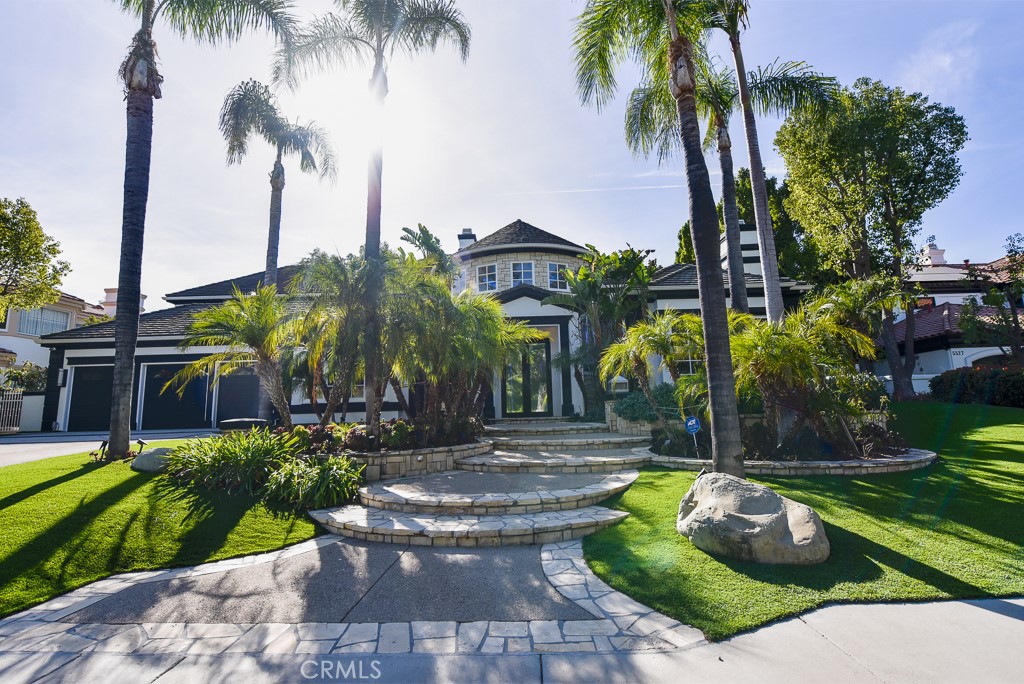 Welcome to this exclusive sanctuary home in the highly sought-after Mountain View Estates of Calabasas. This home is an architectural masterpiece where luxury, comfort, and modern design come together in perfect harmony. Spanning an impressive 7,329 square feet, this estate is the epitome of sophistication, offering a lifestyle of unparalleled opulence and breathtaking beauty.
Nestled in one of the most prestigious neighborhoods, this home is a rare gem, where serenity meets grandeur in every corner. Fully furnished with hand-selected designer pieces, it is an entertainer’s dream, bathed in natural light that accentuates the open-concept spaces. With six expansive bedrooms, seven lavish bathrooms, and meticulously crafted living areas, this home offers the ultimate in both style and functionality.
The attention to detail is evident at every turn—from the custom-crafted fireplaces adorned with exquisite stones to the flawless finishes that elevate every room. The chef’s kitchen is nothing short of spectacular, featuring top-of-the-line appliances, custom cabinetry, and an oversized island, making it a perfect space for both intimate gatherings and large-scale entertaining. Whether you’re preparing a gourmet meal or hosting a dinner party, this kitchen is a true culinary haven.
The luxurious primary suite offers a peaceful retreat, with his-and-hers walk-in closets and a spa-inspired ensuite bath designed for relaxation and indulgence. A sanctuary in itself, it exudes elegance and tranquility. The home offers plenty of closet space, even including a grand motorized closet carousel, which is sure to wow and impress.
Step outside into a true paradise, where a sparkling pool invites you to unwind and an incredible half-court basketball court adds a playful touch to the resort-like atmosphere. Designed for both relaxation and entertaining, the outdoor living spaces are nothing short of extraordinary, with ample space for dining, lounging, and enjoying the Southern California sun.
Perfectly situated just minutes from the Calabasas Commons, high-end shopping, and gourmet grocery stores, this estate provides not only luxury but also unmatched convenience. This home offers the perfect blend of elegant design, tranquility, and access to everything the vibrant Calabasas lifestyle has to offer.
More than just a home, this is a once-in-a-lifetime opportunity to live the dream—luxury, comfort, serenity, and style.