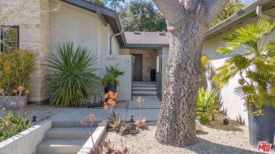 Beautifully updated turnkey midcentury home on one of the most desirable and peaceful streets in Upper Nichols Canyon. Ideally situated just minutes from the Studios and the Sunset Strip, this stylish residence offers an open, airy floor plan with a wall of sliding glass doors that connect the dining and spacious living rooms to a completely private backyard- with room for a pool, and perfect for outdoor entertaining. The sleek kitchen features commercial-grade appliances, including a built-in cappuccino maker, and opens seamlessly to an expansive family room. Wide-plank oak floors run throughout the home. The primary suite includes a large walk-in closet, a serene private courtyard, and a luxurious bath with a soaking tub. Two additional bedrooms and three full baths are finished in natural stone. Additional highlights include a separate laundry room, skylights throughout, and a two-car garage with direct access through the gated entry courtyard. A central sound system and exterior security cameras enhance comfort and security. Gated, private, and set on a cul-de-sac in one of the most sought-after Hollywood Hills neighborhoods, offering the best price per square foot for a pristine, move-in-ready midcentury home!