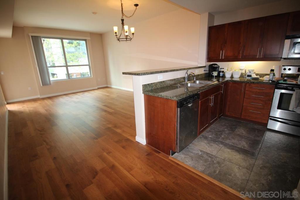 Enjoy the luxuries of this large (905 sq/ft) upgraded 2nd floor unit next to the new library and Petco Park! The home features: hardwood flooring, beautiful kitchen with granite counter tops, stainless steel appliances. Other amenities include: A/C, washer/dryer, large windows for plenty of natural sunlight. This unit has one assigned parking space. Building is VA approved. Complex features include 24 hours security guard, exercise room, recreation room, large terrace deck w/ BBQ & seating, on-site management, gated community near Petco Park & downtown library. Dog friendly walking distance to all including, SD Bay, Embarcadero, Convention Center, walkways lined with trees for extra natural beauty. Complex Features: ,,,,, Equipment: Dryer, Washer