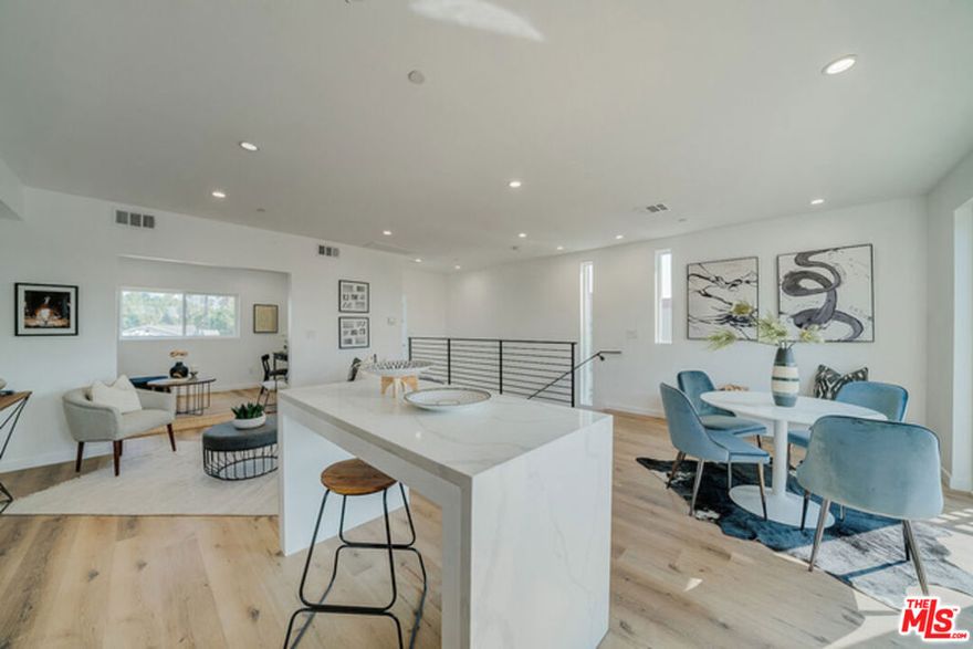 739 N Mariposa Ave | Los Angeles, CA 90029 For Lease  Contemporary 3 Bed | 3 Bath Townhome | Private Garage. Welcome to this stunning 3-bedroom, 3-bathroom modern residence in the heart of East Hollywood  offering the comfort and privacy of a single-family home with the ease of luxury townhome living. Built in 2020, this designer-curated unit spans three levels of light-filled interiors with high ceilings, wide-plank flooring, and sleek architectural lines throughout. Interior Features: Expansive open-concept living and dining area ideal for entertaining. Gourmet kitchen with stainless-steel appliances, gas range, and quartz waterfall island. Custom cabinetry with soft-close drawers and ample storage. Designer bathrooms featuring large-format tile, black fixtures, soaking tubs, and frameless glass showers. Three spacious bedrooms including an en-suite primary with spa-inspired bath. In-unit washer/dryer and central air conditioning. Additional Highlights, Private two-car garage with direct access. Gated property with secure entry and surveillance. Energy-efficient construction and contemporary finishes throughout. Flexible floor plan with potential work-from-home space. Location Perfectly positioned near Silver Lake, Los Feliz, and Hollywood  minutes from DTLA and major employers like Netflix, Sunset Gower Studios, and Kaiser Permanente. Enjoy proximity to neighborhood cafes, restaurants, and new mixed-use developments transforming the area into one of LA's most exciting creative corridors.