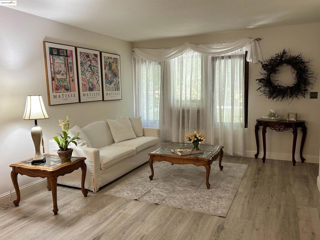 This property is eligible for The Community Advantage Program: discounted rates, no mortgage insurance, and a minimum down payment of 3%! Tucked into one of Pleasant Hill’s most peaceful, tree-filled communities, this beautifully updated 3-bedroom, 2-bath home feels like a garden retreat. It’s a ground-floor unit with a charming porch, private garage, and plenty of guest parking. Inside, you’ll find brand new wide-plank laminate flooring, fresh paint, and wood-trimmed windows that fill the space with natural light. The remodeled kitchen features new cabinets, granite countertops, and a modern layout. The primary bedroom has vaulted ceilings and a private balcony overlooking trees and greenery. It's located on the ground level. Both bathrooms are tastefully updated. Downstairs are two more bedrooms, also updated, with one opening to a second balcony with beautiful views to help you relax and unwind. The laundry closet with washer and dryer is conveniently downstairs. The complex offers a rustic charm with tall trees, walking paths, a sparkling pool, and well-kept grounds. All this, just minutes to freeways, shopping, dining, and schools. A perfect blend of nature, comfort, and convenience. Open House Sat 9/6 & Sun 9/7 1-3PM.