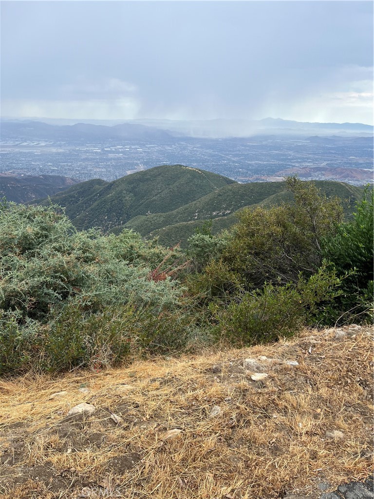 Wonderful opportunity to build your dream home in the mountains.  This lot offers gentle downslope, making it ideal for building, and showcases beautiful views of the mountains and the city lights.  Peaceful setting with natural surroundings, yet close to town, highway access and amenities.