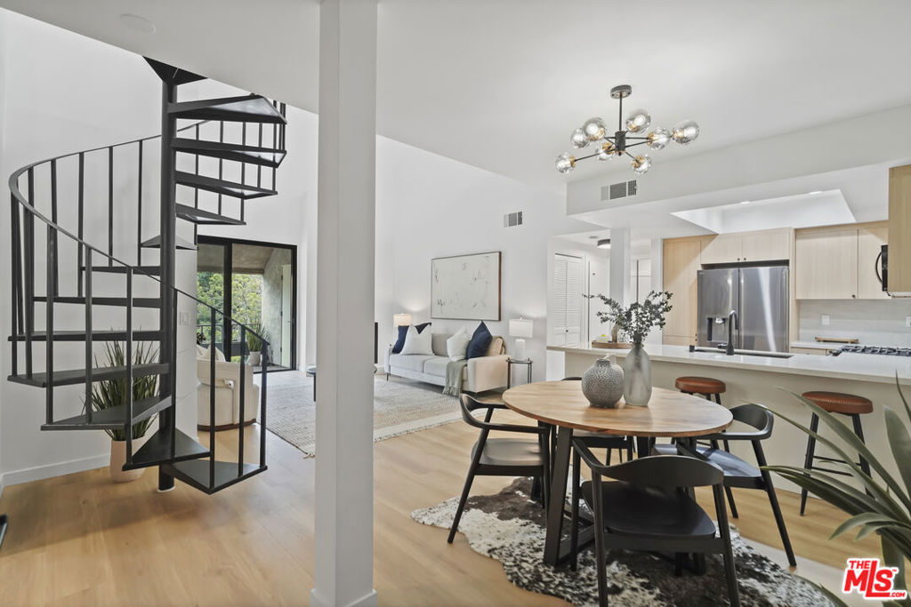 Enjoy resort-style living at its finest in the heart of Silicon Beach. Just completed and designer done, this extensively renovated top-floor corner penthouse showcases 2 spacious bedrooms, 2 luxurious bathrooms, and a versatile loft that can easily serve as a 3rd bedroom or an inspiring flexible living space. The home features luxury vinyl plank floors throughout, new doors and hardware, recessed lighting in the bedrooms, and soaring vaulted ceilings that enhance the sense of space. The updated chef's kitchen boasts quartz countertops and matching backsplash, black stainless-steel appliances, a breakfast bar, and an adjacent dining area, perfect for entertaining. The spacious living room and primary bedroom both provide direct access to a balcony with tree-top views. Both well-sized bedrooms offer en-suite, spa-like bathrooms and ample closet space. The spiral staircase leads to a versatile loft area with built-in storage ideal for an office, guest room, or third bedroom. Additional highlights include in-unit laundry, HVAC, two parking spaces, massive additional storage room off of the loft and on the balcony, an updated electrical subpanel, and more! Seagate Village is a secure, gated community offering resort-style amenities: two swimming pools, three spas, two tennis courts, serene streams, and lush landscaping. All this just a short walk to the beach, top restaurants, and scenic biking and walking paths. Live the best of Silicon Beach right at your doorstep.