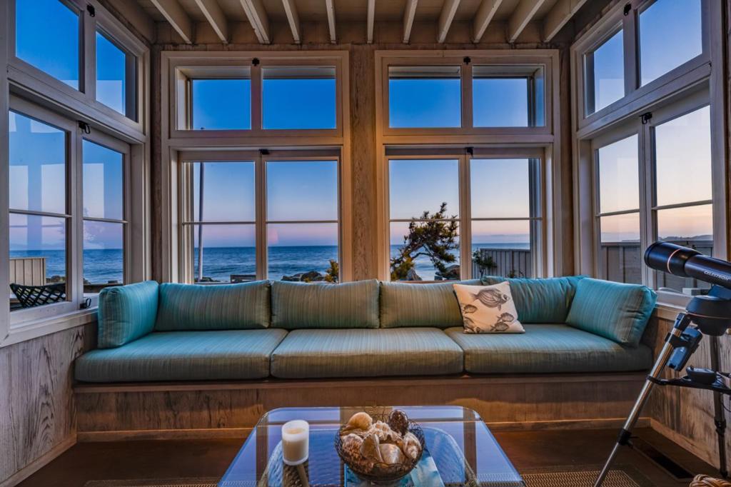 This beachfront home offers what truly matters, the ability to escape the chaos of the world and enjoy beach life effortlessly. Nestled in Santa Cruz County's premier gated enclave, your private staircase leads directly to the sand, creating spontaneous everyday joy few properties can claim. Imagine morning coffee while dolphins play offshore, sunset gatherings where ocean views enhance conversation, or simply relaxing with a book in your intimate ocean-view reading nook while whales breach in the distance. Behind two gates, this architectural treasure balances vintage character with modern updates, featuring beautiful stained redwood walls, an expanded kitchen, and updated bathrooms. The built-in banquette offers a perfect retreat to disconnect from the world's chaos and reconnect with what matters. Located near Seacliff & Aptos villages, you'll appreciate convenient access to restaurants & shopping while enjoying peaceful beachfront living with miles of gorgeous walking beach in both directions. Here, entertaining shifts seamlessly from indoor to sand, making the ocean part of everyday life. When the world becomes too much, this is where you come to simply breathe, relax, and remember what life is truly about.