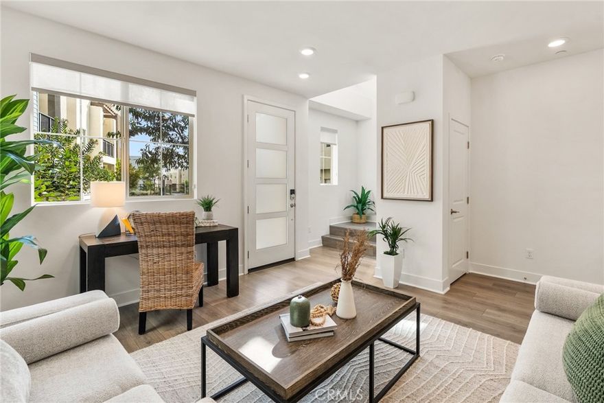 RARE ANGLED LOT | 1 OF 3 IN HARBOR POINTE | BUILT 2023
Step inside a home designed for convenience and coastal enjoyment in the gated community of Ponte Vista, adjacent to Rancho Palos Verdes. Built in 2023, this modern 3-bedroom, 2.5-bath home delivers advantages rarely found in older South Bay homes: up-to-date systems and energy-efficient design. It occupies a premium lot with a unique rotated orientation, 1 of only 3 within Harbor Pointe's 94-home neighborhood. Its angled placement creates practical separation from neighboring homes, enhancing natural light exposure while providing an inviting front courtyard, side storage, and greater privacy. Featuring over $80,000 in carefully selected upgrades, the 1,709 sq ft (BTV) interior showcases the home's functional elegance.
 
LIVING & ENTERTAINING
The home's tri-level floorplan creates distinct spaces for daily routines. Stylish RevWood plank flooring flows throughout, complemented by tile flooring in the primary and guest baths. The first floor features a flexible bonus room, ideal as a home office, guest quarters, or workout space. On the second level, the heart of the home naturally blends living, dining, and cooking spaces. The kitchen features Symphony Canvas cabinetry, quartz countertops, designer backsplash, and GE stainless appliances. A spacious island is perfect for everyday cooking or casual entertaining. This level also includes a laundry area with GE washer and dryer.
 
RELAXATION & FUNCTION
Upstairs, the owner's suite offers peekaboo views of the bridge and harbor from both the bedroom and walk-in closet. An art deco-style sliding barn door leads to the bathroom, which features dual vanities and a large, contemporary shower. Two additional bedrooms and another full bath round out the upper level.
 
SMART & SUSTAINABLE FEATURES
The home includes a fully owned 9-panel rooftop solar array (3.15 kWp), dual-zone smart thermostats, ceiling fans in the living room and all three bedrooms, a tankless water heater, and Ring video doorbell. The attached 2-car garage features a WiFi Liftmaster MyQ garage opener.
 
PONTE VISTA RESORT-STYLE AMENITIES
Residents enjoy exclusive community amenities, including security patrol, heated pool, spa, fitness center, dog park, BBQ area, fire pit, and nearby walking trails. Affordable HOA fees complement the location, offering easy access to beaches, shopping, dining, major freeways, and the vibrant waterfront redevelopment at West Harbor slated for 2026