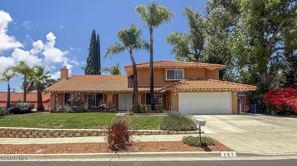 Upgraded & Spacious Santa Barbara Model with a PRIVATE Backyard Oasis in the Heart of Thousand Oaks! Welcome to 167 Siesta Avenue--a rarely available, light-filled Santa Barbara model resting on a quiet, tree-lined street within one of Thousand Oaks' most desirable neighborhoods. Featuring 4 bedrooms (easily modified to 5 bedrooms), plus loft, and 3 bathrooms, nearly 2,870 square feet of living space, and a sprawling 9,147 square foot lot, this beautifully enhanced residence blends comfort, functionality, and a layout designed for indoor-outdoor living. From the moment you arrive, the curb appeal impresses with lush, mature landscaping, vibrant garden beds, and a graceful walkway leading to the covered front porch--the perfect spot to enjoy a morning coffee beneath the shade of established greenery. Step inside to find a bright, flowing interior adorned with rich WALNUT wood flooring, crown molding, and tall dual-paned mullioned windows that flood the space with natural light. The Living Room creates a warm, elegant atmosphere with its inviting tile-surfaced gas/wood-burning fireplace, while the formal Dining Room exudes charm with wainscoting details and generous windows framing serene backyard views. For those needing flexible space, a downstairs bedroom near the entry offers the ideal work-from-home office, guest suite, or playroom, complete with windowed French doors, built-in closet, and front-facing windows. The adjacent full bathroom includes ceramic tile flooring, a built-in vanity, and standing shower. The heart of the home centers around the Family Room and bright eating nook, both overlooking the private backyard. The Family Room is media-ready with a handsome slate-surfaced fireplace, custom built-ins, and sliders that lead seamlessly outside. The adjoining Kitchen has been beautifully updated with granite countertops, stainless-steel double sink, custom cabinetry, and high-end appliances--including a GAGGENAU gas cooktop + wok burner and GAGGENAU double oven. Upstairs, the private Primary Suite offers TWO closets (including a deep walk-in), a cozy sitting nook, and abundant natural light. The remodeled en-suite bath dazzles with a granite-topped dual sink vanity, a makeup station, and a deep, fully upgraded shower wrapped in glass mosaic accents. Two spacious secondary bedrooms provide ample comfort--one boasting an OVERSIZED layout with the option to convert into two separate bedrooms thanks to dual electrical setups. A versatile loft landing makes for the perfect kids play area, gym, or second office space. Additional highlights include a fully updated hall bath with granite-topped dual sink vanity and a tiled tub/shower, an individual indoor laundry room with storage cabinetry and direct garage access, and a functional 2-car garage with built-in workbench and storage solutions. The backyard is a true PRIVATE retreat, framed by tall greenery and offering sprawling lawns, a substantial covered patio, and plenty of space for a pool or expanded outdoor entertaining area. The wide side yard, complete with 8x10 storage shed, offers incredible flexibility for a workshop, dog run, boat parking, or putting green. This peaceful enclave is prized for its proximity to Thousand Oaks' best amenities, including the renowned Wildwood Regional Park with miles of hiking and biking trails, public tennis courts, playgrounds, and sports fields. Top-rated schools--Aspen Elementary, Redwood Middle, and Thousand Oaks High--are all nearby, along with convenient shopping, dining, and quick access to the 101 and 23 freeways. Thousand Oaks is celebrated for its mild Mediterranean climate, year-round outdoor lifestyle, and abundant open space--experience the best of it all at Siesta Avenue!