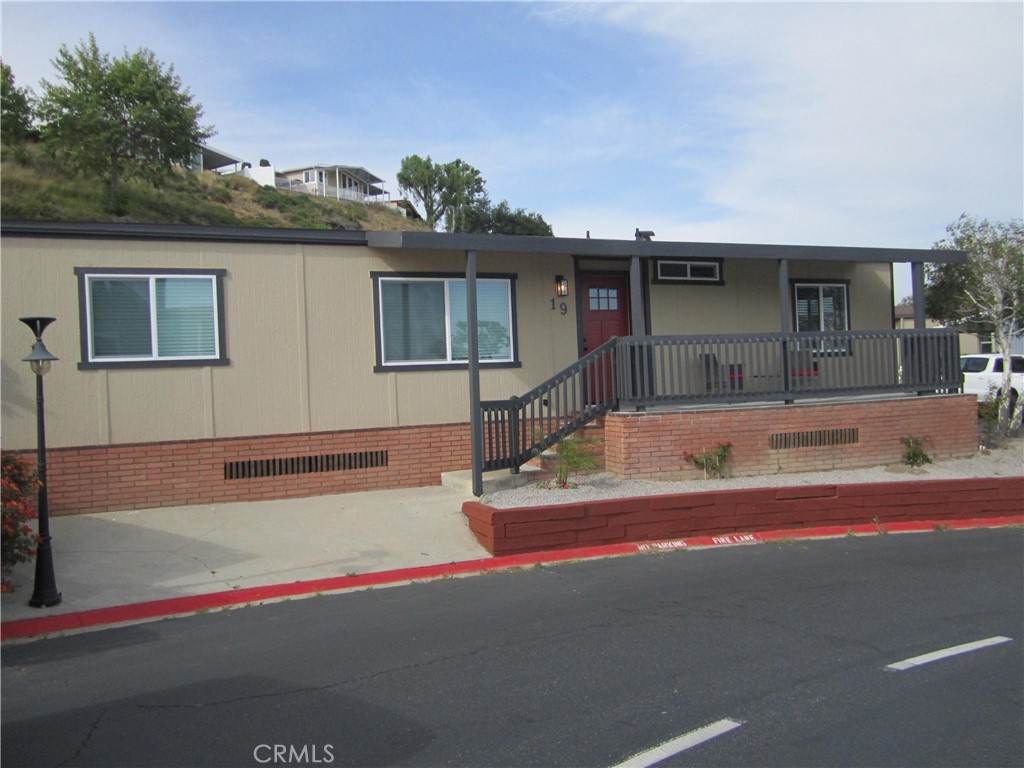 This home has incredible 3 bedroom and 2 bath Home has been updated top to bottom. The Home has new kitchen, new bathrooms along with a new roof, new paint inside and out. The home comes fully furnished (optional) and brand new appliances. Incredible hillside views and is located on a quite corner lot . Great Valley Views from the front. Enjoy this Charming Manufactured Home, peaceful serenity overlooking the San Fernando Valley, high above the noise at the top of the community. Private, Gated Community, nestled up in the mountains in a very scenic setting and tranquil. This is the nicest home in the community and is definitely a must see.
