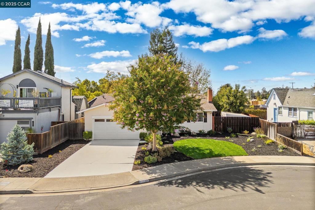 This beautifully modernized east facing single-story home offers 3 bedrooms and 2 bathrooms on a large, private lot in the desirable neighborhood near Pleasanton. The layout provides a smooth connection between indoor and outdoor, with a living room, dining area, kitchen, and family room flowing to the backyard. The home is light and bright, featuring a living room with a modern fireplace, stacked tile surround, and classic mantle, plus a dining area, updated kitchen, renovated bathrooms, and spacious bedrooms. The kitchen includes granite countertops, stainless appliances, smooth-surface cooktop, oven, refrigerator, maple cabinetry, and a peninsula for extra prep space and casual dining. The hall bathroom has an updated vanity, lighted mirror, countertop, and shower. The primary suite features a shaker-style vanity, contemporary fixtures, and a tiled shower. Additional features include updated lighting, recessed fixtures, new flooring, door hardware, and an insulated garage with laundry area, sink, built-in cabinets, and EV charger outlet. The backyard offers lawn area, a patio, large woodshed, persimmon and apple trees, and a grapevine, with room for RV parking, pool or ADU. Conveniently located near parks, trails, schools, downtown, ACE Train, BART, and Freeway. Open Sat & Sun