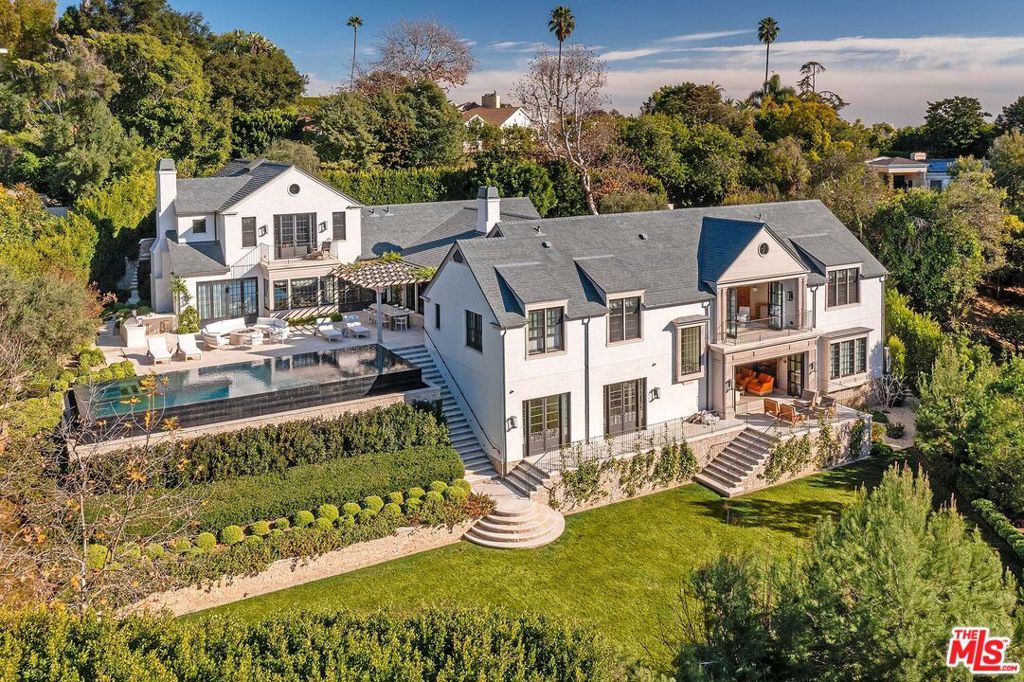 "Bentley House" - One of the finest new construction traditional estates in the city. A combination of style and substance. Designed by Oren Dothan, interiors by Marie Carson and grounds by Christine London. Every space is thoughtful and precise. Over 9,000sqft of exquisite architecture and design. Complete privacy behind high gates and hedges. Cobblestone driveway leads to a motor court and front door with stunning water feature - setting the stage for a world-class residence. A world apart, with magical grounds brought in via magnificent steel doors. Gourmet kitchen with adjacent living room and banquet breakfast area. Paneled formal dining room. Primary bedroom is serene and glamorous with marble bath and vast walk-in closets. Professional screening room with adjacent bar and wine cellar. Exquisite lacquered office over looks the grounds. Additional features include: light-filled gym, infinity edge pool and verdant meadow. A must see to believe, a rare opportunity to acquire a gem.