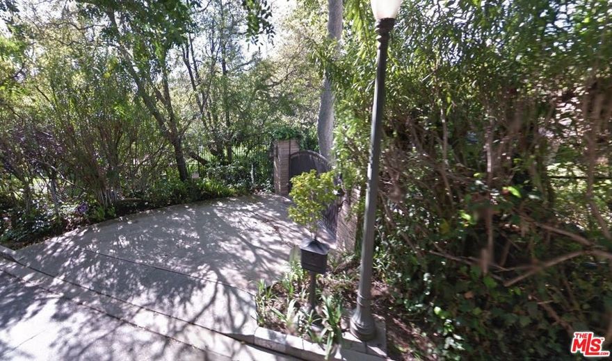 "Bentley House" - One of the finest new construction traditional estates in the city. A combination of style and substance. Designed by Oren Dothan, interiors by Marie Carson and grounds by Christine London. Every space is thoughtful and precise. Over 9,000sqft of exquisite architecture and design. Complete privacy behind high gates and hedges. Cobblestone driveway leads to a motor court and front door with stunning water feature - setting the stage for a world-class residence. A world apart, with magical grounds brought in via magnificent steel doors. Gourmet kitchen with adjacent living room and banquet breakfast area. Paneled formal dining room. Primary bedroom is serene and glamorous with marble bath and vast walk-in closets. Professional screening room with adjacent bar and wine cellar. Exquisite lacquered office over looks the grounds. Additional features include: light-filled gym, infinity edge pool and verdant meadow. A must see to believe, a rare opportunity to acquire a gem.