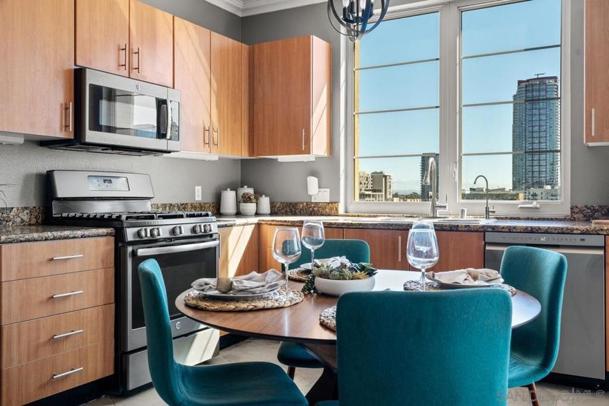 Welcome to Union Square, where urban convenience meets contemporary comfort. This 5th-floor corner unit is flooded with natural light through expansive windows and features soaring 9-foot ceilings that create an airy, open feel. A true rarity downtown, this is a full **3-bedroom residence—not a 2-plus-den/loft—** with generously sized rooms, an open-concept layout, ample storage throughout, and gorgeous views of the city & Coronado Bridge! The primary suite offers an ensuite bath and a large walk-in closet with built-ins. Both bathrooms feature shower/tub combos, granite vanities, and updated modern lighting. Additional highlights include central AC and heating, two parking spaces with a storage cage above, and a seamless flow between the living, dining, and kitchen spaces—perfect for everyday living or entertaining. Step outside your door and enjoy all that Downtown San Diego has to offer. You’re just steps from San Diego City College, a short walk to Petco Park, and positioned near the highly anticipated East Village Green (Phase 1 opening in 2025). Union Square is a pet friendly building and residents enjoy resort-style amenities, including a fully equipped fitness center with sauna and jacuzzi, BBQ areas, a community lounge and party room, EV charging stations, and a year-round calendar of social events. Onsite management ensures peace of mind, while the vibrant East Village location keeps the best of downtown dining, culture, and entertainment within easy reach.