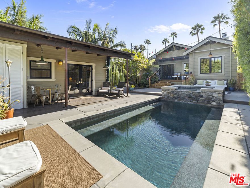 Tucked behind a secure gate and six-foot fencing, this beautifully preserved Craftsman offers over 2,500 sq ft of privacy, historic charm, and timeless curb appeal in one of L.A.'s most desirable neighborhoods, Sunset Square. The main residence includes 2 bedrooms and 2.5 bathrooms, with the option to convert the oversized library and sunroom into a third bedroom. Original details --- three fireplaces, crown molding, wainscoting, and restored windows blend seamlessly with thoughtful updates by acclaimed designer Matthew Lanphier. Highlights include a spacious designer kitchen and a reimagined primary bathroom with heated floors. The resort-style backyard features a sparkling pool, raised spa, outdoor shower, and multiple lounge areas. A fully permitted 700 sq ft ADU offers its own kitchen, bathroom with heated floors, and in-unit laundry.Live in one, lease the other, or enjoy as a private compound --- this unique property offers comfort, flexibility, and character in the heart of historic Sunset Square. Conveniently located near luxury coffee shops, Ralphs, Trader Joe's, and Bristol Farms, as well as fine dining, scenic hikes, and vibrant nightlife.