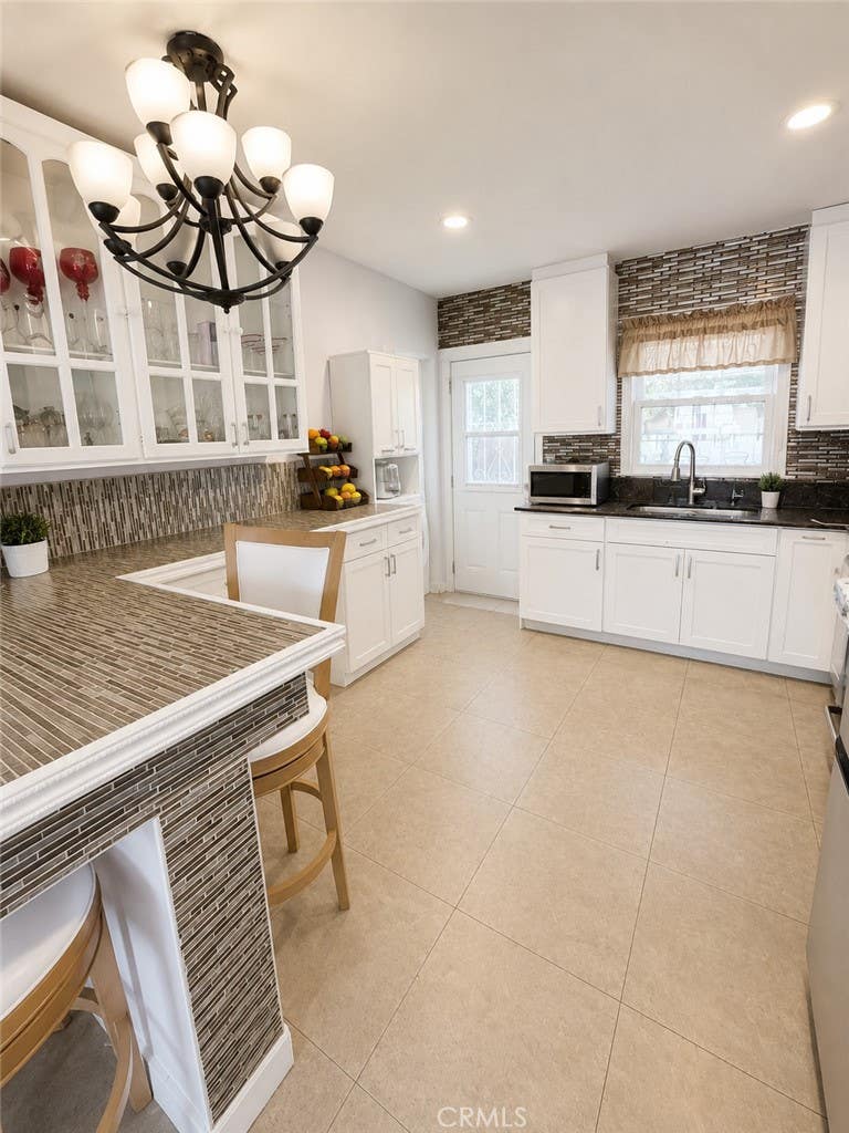 Photo of 314 S Barron Ave, Compton, CA 90220 (MLS # DW26131530)
