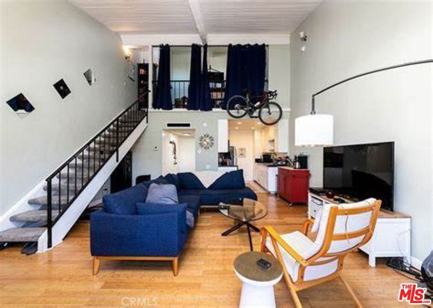 Bright & Stylish Loft Condo at Encino Oaks. Welcome home to this top-floor end-unit loft condo in the desirable Encino Oaks Condominiums! This spacious unit combines comfort and convenience with thoughtful features throughout. Enjoy a private upstairs loft with a full bath, plus a convenient quarter bath downstairs for guests. The entryway offers a large closet, and there's an additional oversized closet upstairs, providing ample storage. The kitchen is both stylish and functional with faux marble countertops, plenty of cabinetry, and tile flooring, while the living area features warm wood laminate floors. Upstairs, the cozy loft is carpeted for comfort. Step outside to your large, private balcony perfect for relaxing or entertaining. The unit also comes with two tandem parking spaces located right next to the elevator for easy access. Additional perks include: Water & trash included in rent, pet-friendly community, resort-like setting with pool, spa, and rec room. This condo truly has it all style, convenience, and location. Don't miss the chance to make this inviting space your new home!