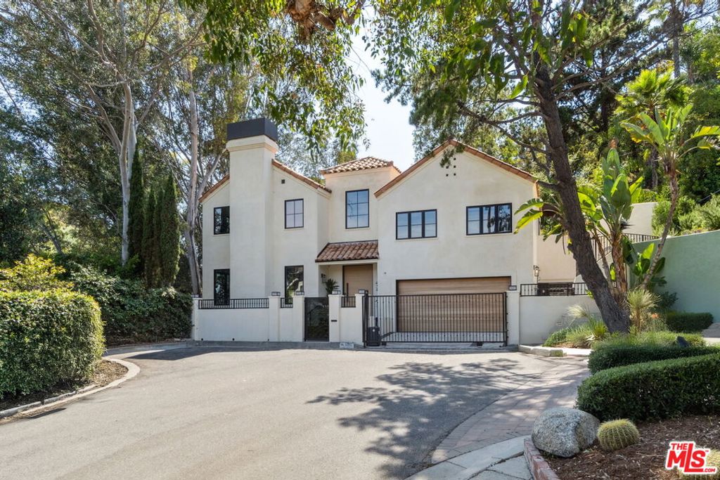 On a quiet cul-de-sac street in Laurel Canyon, this newly completed and reimagined residential compound is located only 5 minutes from the center of the Sunset Strip. Enter through private gates to the tranquil hillside setting surrounded by flat yard and gardens spread over approx. 3/4 acre. Once you enter the 2 story Entry Hall you are immediately welcomed by a traditional floorplan with a substantial Living Room with French doors opening to nature. It feels like a virtual Treehouse atmosphere with complete privacy. Also off the main hall is a dedicated Dining Room overlooking the sunny green lawn and tall cactus garden. High ceilings and endless windows prevail throughout the interior. Venture into the open-concept kitchen and family room, featuring a cook's kitchen with large pantry and convenient built-in breakfast nook. Access the al-fresco dining terrace from Kitchen or Din Rm offering a retreat with a lion's head water fountain, suggesting a total vacation feel. Heading upstairs, you will be greeted by a large Lounge area, billiards / ping pong room with a Study area adjacent. Nearby is a spacious Screening Room, Recording Studio, which also doubles as a 3rd large lounge area in this home. Primary Bedroom Suite provides custom wrought-iron windows, balcony terrace overlooking serene greenery, and a significant bathroom with obsidian tub and walk-in closet. Head outside to a charming hillside pathway leading to a sun-soaked Pool, Spa and Cabana which is open to endless canyon city and canyon views.--even a peek at downtown LA skyline.