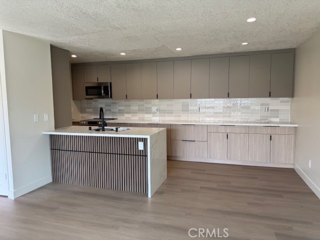 Welcome to this beautifully bright second-floor unit located in the heart of South Coast Metro. Renovated. This 2-bedroom, 2-bathroom condo offers an open-concept floor plan designed for comfortable living and entertaining. Step into the spacious living area, where natural light pours in, creating a warm and inviting atmosphere. The highlight of the home is the large private balcony that overlooks the serene, gated community adorned with lush landscaping and mature trees—perfect for your morning coffee or relaxing evenings. Convenience is key with this unit’s prime location, just moments away from the renowned South Coast Plaza, where world-class shopping and dining await. Parking is a breeze with one assigned covered carport and an additional permit for a second vehicle. Look at the photos is so well done. Don’t miss the opportunity to enjoy modern living in a peaceful and secure community, all within one of Orange County's most sought-after neighborhoods.
