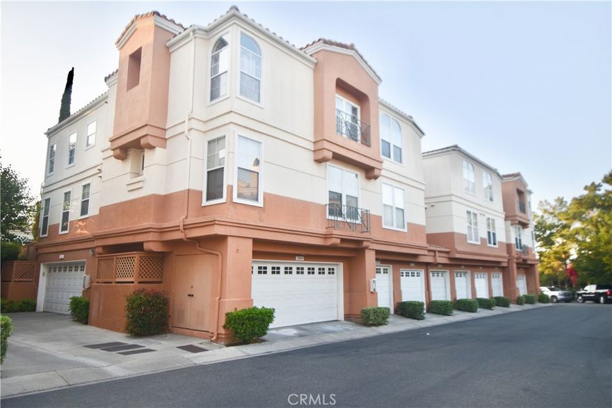 Beautiful townhouse in the nice gated community of The Summit Renaissance, Anaheim Hills area * 5 star rating Canyon Rim Elementary School is nearby * Nice & quiet area *  Bright & light windows with high ceiling * Cozy fireplace in the living room * Newer upgraded kitchen appliances with shiny countertop & cabinets * Romantic Master Bedroom * Dark-brown wood lamination floors * A refrigerator & newer stacked washer/dryer unit and newer stove are included with the sale * Well kept home with 2 car attached & extra space for storage * A new garage door & controlling unit are newly installed * Walking distance to community pool/spa & gym room * Convenient location to school, shoppings & freeway * Won't last long!