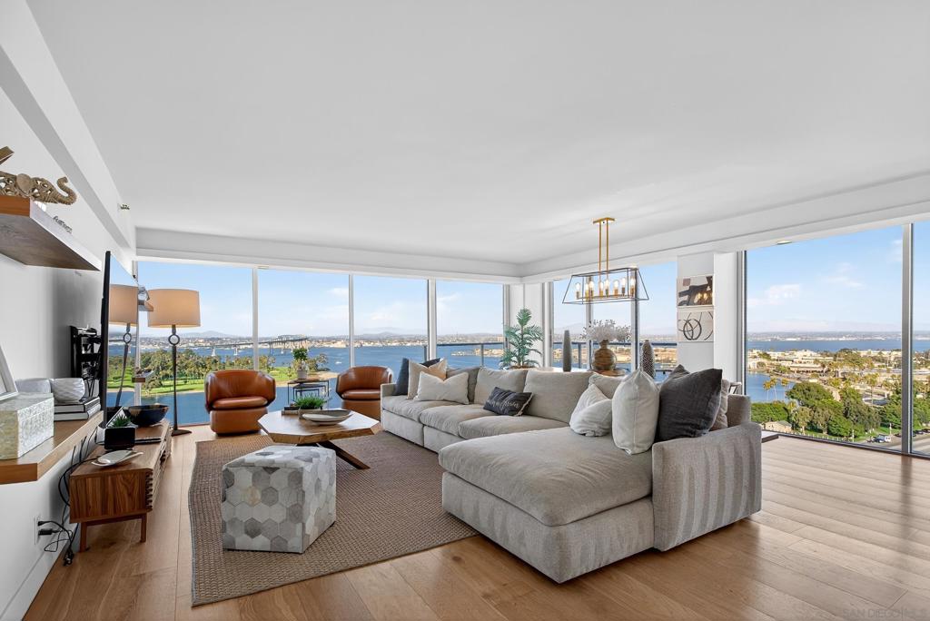 Experience resort-style living in this stunning 15th-floor fully furnished 3 bed / 3 bath condo at Coronado Shores. Expansive floor-to-ceiling glass doors open to a spacious veranda with panoramic views of Glorietta Bay, the Pacific Ocean, and the San Diego skyline. The light and airy layout provides plenty of room to relax or entertain, making it perfect for year-round living, a seasonal retreat, or a long-term rental. Residents enjoy unmatched amenities, including four pools and spas with barbecue areas, eight tennis courts, 2 pickle ball courts a fitness center, sauna, steam room, an exclusive private Beach Club, a community event pavilion, 24-hour concierge, and security. Just steps from Coronado’s sandy beaches, the Hotel Del Coronado, local shops, and dining, this home also includes one assigned parking space, offering the very best of the prestigious Coronado Island lifestyle.