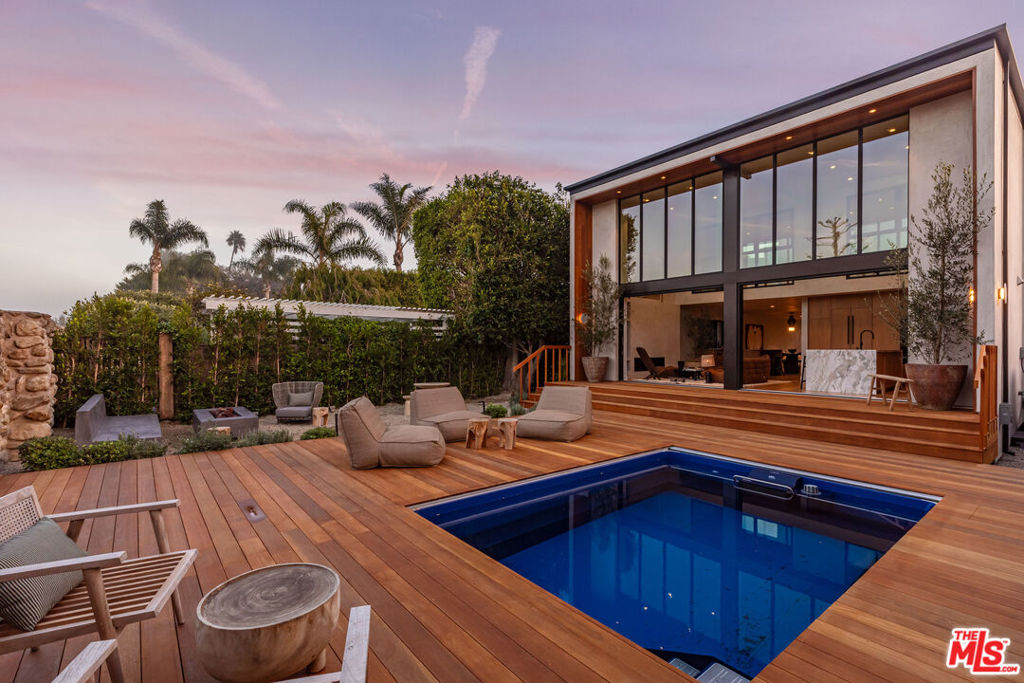 Located behind the exclusive gates of the renowned Malibu Colony, this beautifully remodeled 4-bedroom, 4-bathroom home offers the ultimate in privacy, luxury, and breathtaking views. With sweeping views of the lush golf course and the Malibu mountains, this coastal retreat is a perfect blend of modern elegance and serene natural beauty. Upon entering, you'll be greeted by expansive living spaces bathed in natural light, featuring high-end finishes and meticulous attention to detail. The open-concept design effortlessly flows from the gourmet kitchen to the living areas, creating a perfect space for both entertaining and relaxation. Large windows throughout showcase the panoramic views, inviting the outdoors in at every turn. The master suite is a true sanctuary, offering a private oasis with a spa-like en suite bathroom and direct access to a peaceful outdoor patio. Each of the additional bedrooms offer comfort and privacy for family and guests. Outdoors, enjoy the beautifully landscaped gardens and a serene patio area, ideal for al fresco dining or simply unwinding while taking in the picturesque views. Just steps from Malibu's iconic beaches, fine dining, and world-class shopping, this home is the epitome of California coastal living. Don't miss the rare opportunity to own this stunning property in one of the most coveted gated communities in Malibu.