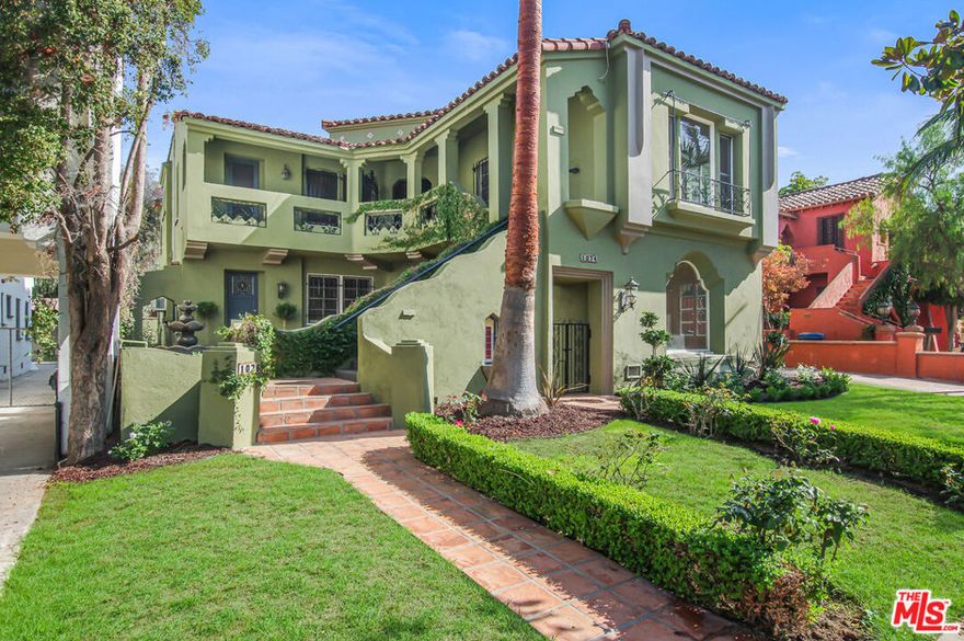 1074 S Genesee Avenue, also known as the Charlotte Chase Apartments, is an architecturally significant Spanish Colonial Revival 4-plex located in the highly desirable Carthay Square / Wilshire Vista neighborhood of Los Angeles. Originally constructed in 1933 for Charlotte Chase herself, the property stands as an exceptional example of well-preserved period architecture and craftsmanship. The building has been carefully maintained and thoughtfully upgraded, featuring in-unit washer/dryers, extensively renovated kitchens and bathrooms, and central HVAC systems on both levels. Additional features include original wainscoting, hardwood floors, decorative ceiling beams, crown molding, and vintage bathroom tile work that highlight the property's historic character. The property is currently receiving extensive cosmetic repairs to the exterior stucco and will be repainted shortly, photos are circa 2020. The 5,054 square foot building sits on a 7,267 square foot LAR3 lot and features a unique unit mix consisting of a massive 2,158 SF 3-bedroom, 3.5-bath owner's unit occupying the entire ground floor, along with a 1-bedroom + 1.5-bath, a 1-bedroom + 1-bath, and a studio on the upper level. The property also includes two detached two-car garages plus three uncovered spaces, providing a total of seven parking spaces. With strong in-place income of just under $13,500 per month, this offering is priced at $2,225,000, equating to $556,250 per unit, $440.25 per square foot, and a 13.74 GRM. Under Senate Bill 1211, an investor may build up to four ADUs and modify or retain some of the seven parking spaces (Buyer to Verify).