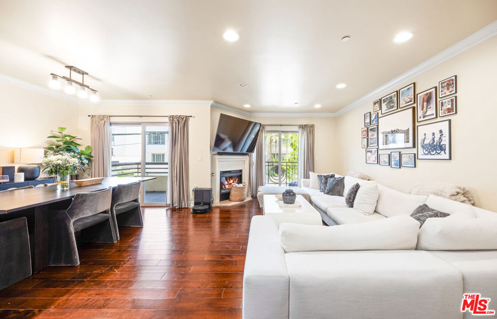 Front-facing, single-level condo located in the heart of Brentwood! Bathed in natural light, this stunning unit features 3 bedrooms, 2.5 baths and 2 parking spaces. Enjoy 5 private outdoor balconies, with every bedroom featuring its own front-facing balcony and serene tree-top views. Situated in a highly sought-after 12-unit building with elevator access, this beautiful home boasts hardwood floors, central AC/heat, a cozy fireplace, an in-unit washer/dryer, and guest powder room. The expansive open-concept gourmet kitchen is perfect for entertaining, complete with a breakfast bar, stainless steel appliances, and a Viking 6-burner stovetop. The spacious primary suite includes a walk-in closet, dual sinks, shower, and a separate soaking tub. Two additional bedrooms share a large bathroom with dual sinks. Secure, gated garage with two parking spaces and storage. Just a short stroll to cafes, markets, boutiques, and top dining spots on San Vicente and Wilshire Boulevards. A rare opportunity to live in one of Brentwood's most desirable locations!