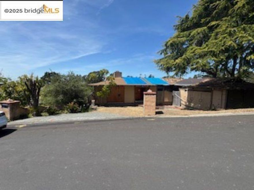 Bring your imagination to this unique opportunity in the desirable Chabot Park neighborhood! Brimming with potential, this captivating 3-bedroom, 2-bath home features an expansive lot of over 1 acre—an outdoor lover’s dream. Enjoy serene natural views from the backyard, along with easy access to nearby trails, shopping, dining, schools, and recreation. What truly sets this property apart is the bonus lower-level area, complete with an additional room and bathroom and its own private entrance. This flexible space is ideal for multigenerational living, a large household, or even the potential for an Accessory Dwelling Unit (ADU)—perfect for added income or guest accommodations.  Pr Whether you're envisioning a stylish renovation, a cozy family retreat, or an investment with significant upside, this home invites your personal touch and creative vision. Don’t miss the chance to transform this property into something truly special.