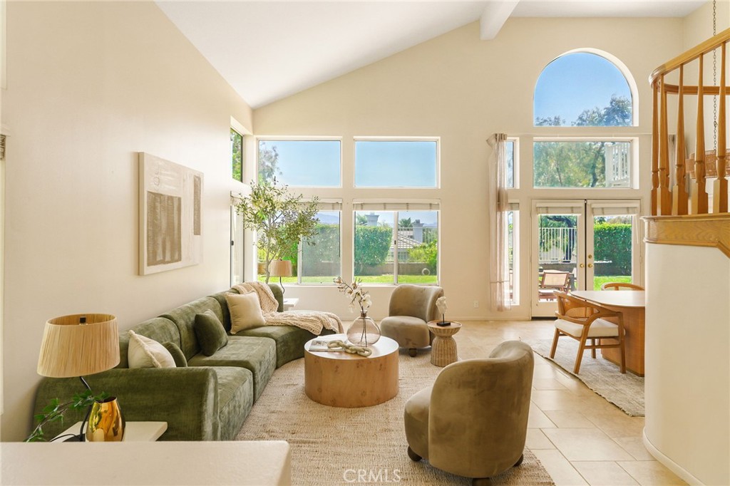 Located on a quiet cul-de-sac in the sought-after Northbridge Point community of Valencia, this beautifully maintained home offers timeless charm and stunning views. The open Montaire-style floor plan with 2,730 sqft features soaring cathedral ceilings and tall windows that flood the space with natural light and frame picturesque views of the San Gabriel Mountains. The layout includes four spacious bedrooms upstairs and a versatile downstairs office that can easily serve as a fifth bedroom, along with three full bathrooms. The oversized primary suite offers a fireplace, sitting area and a very spacious en-suite bathroom with a soaking tub and walk-in closet. Enjoy morning coffee or cool evenings on the private deck for relaxing and taking in the landscape. The home also boasts a spacious formal living area, dedicated dining, and a family room off of the bright eat-in kitchen—perfect for everyday living and entertaining. Step outside to a private grassy backyard with a scenic view, ideal for outdoor gatherings. Additional highlights include ample parking and storage with the 3 car garage, walking distance to award winning schools, parks and the two Northbridge Point community pool/spas and close access to Santa Clarita’s walking/biking paseo trail system and a short drive to restaurants, and shops.