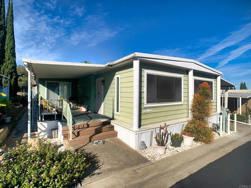 Located in the highly desirable Villa Novia Estates, which is nestled at the base of Mount Helix, this spacious mobile home is perfect for someone who wants to live in a 55 and older community.  This home has 1440 sq feet of living space that includes 2 bedrooms, 2 bathrooms, two living rooms, a sunroom, an indoor laundry room, dining room and a kitchen with plenty of storage space for all your needs.  The home has central air to keep you comfortable even if the temperatures outside are not comfortable.  The home also includes two storage sheds to handle some of your extra items or seasonal decor.  There are numerous trees which are fully irrigated, including mature apple, peaches, nectarines, and lemon trees.  The community has several amenities that can be enjoyed such as a swimming pool, library, clubhouse, billiard room, and outdoor games area.  There is also an area to store RV's and boats.  Call to set up a viewing of the property by calling John Zieske at 619 504-4092.